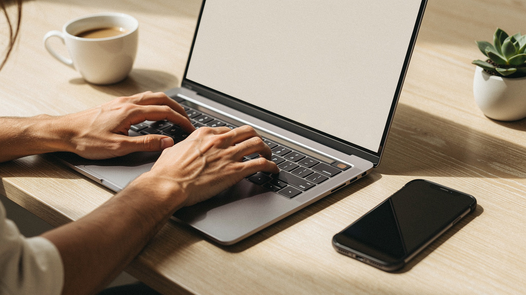 Professional working with digital tools at desk