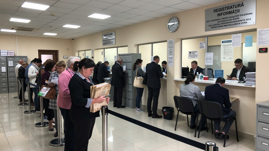 Long queue at government office showing traditional bureaucratic process