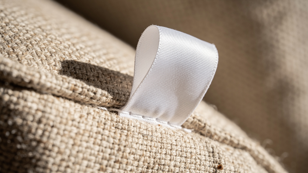 Fabric care tag on sofa upholstery