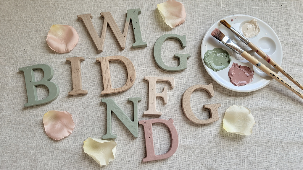 Painted wooden letters in various wedding colors