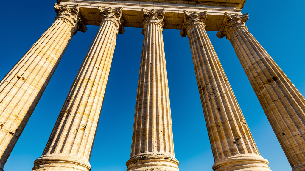 Five classical columns representing foundational pillars