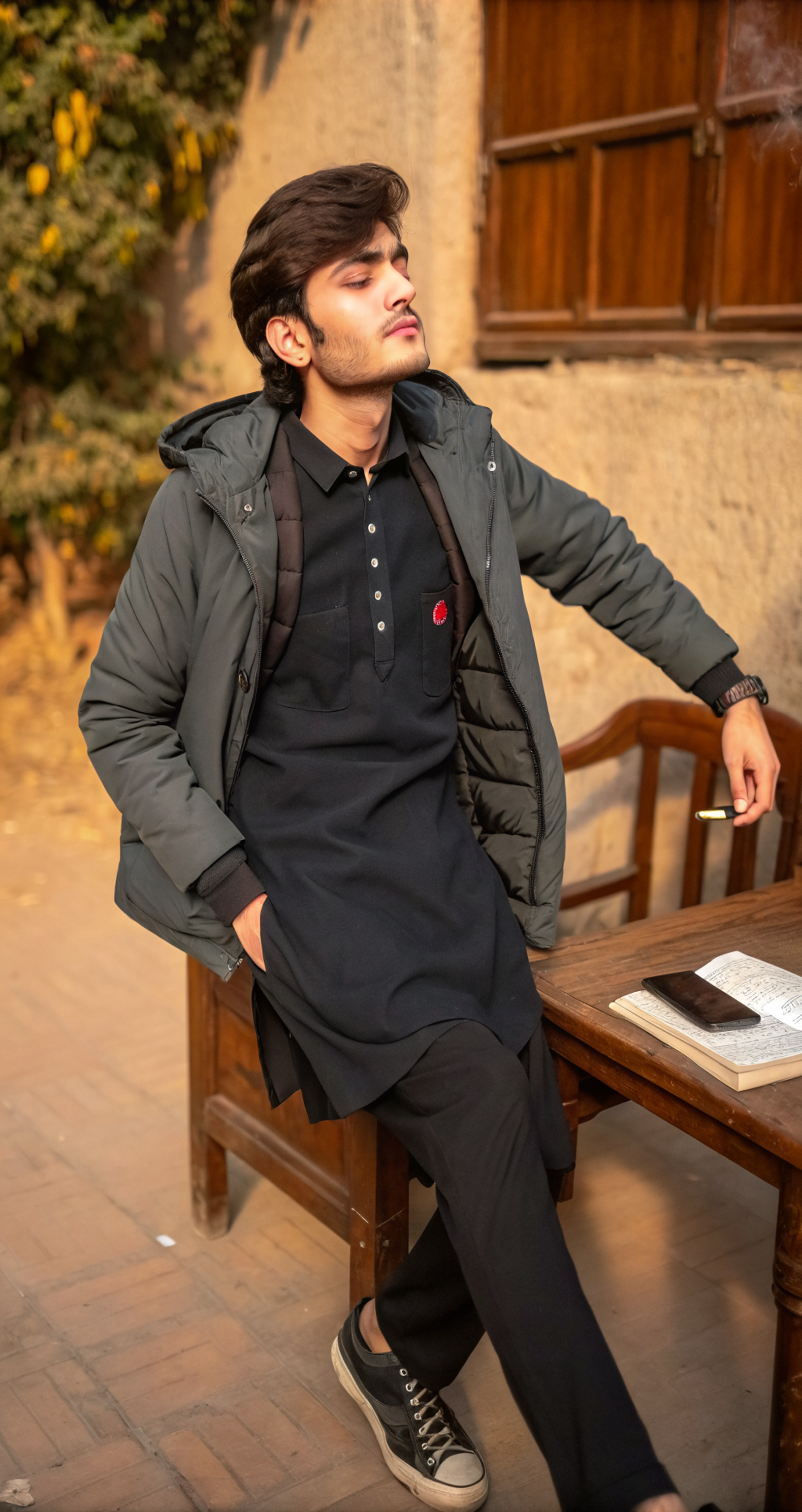 a-young-man-sitting-on-a-wooden-chair-5rr4obbuu1