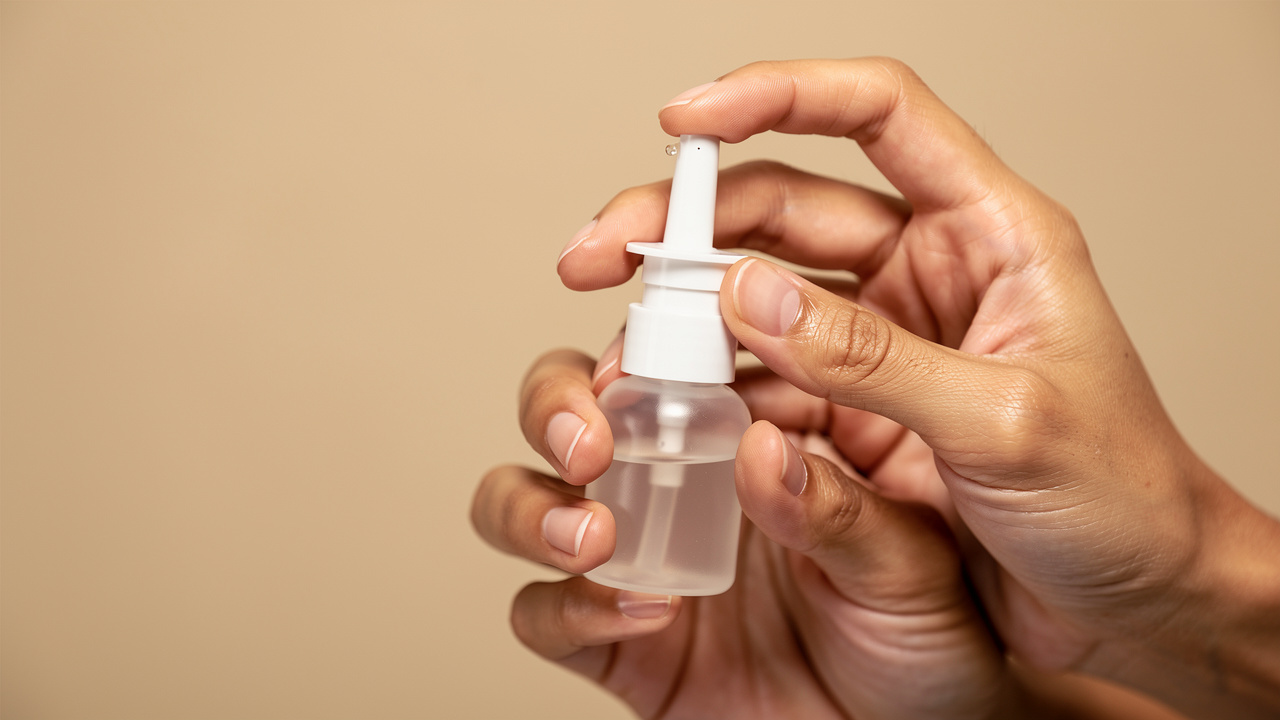 Proper hand position for nasal spray use
