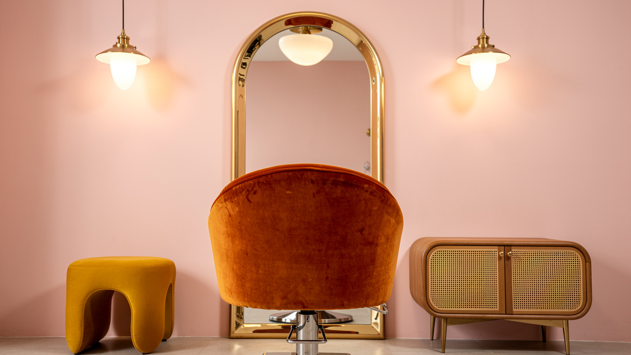Retro-style salon station with curved furniture and bold colors