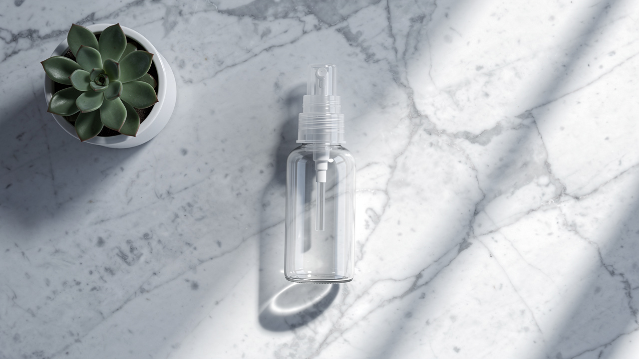 Nasal spray bottle on marble surface with natural lighting