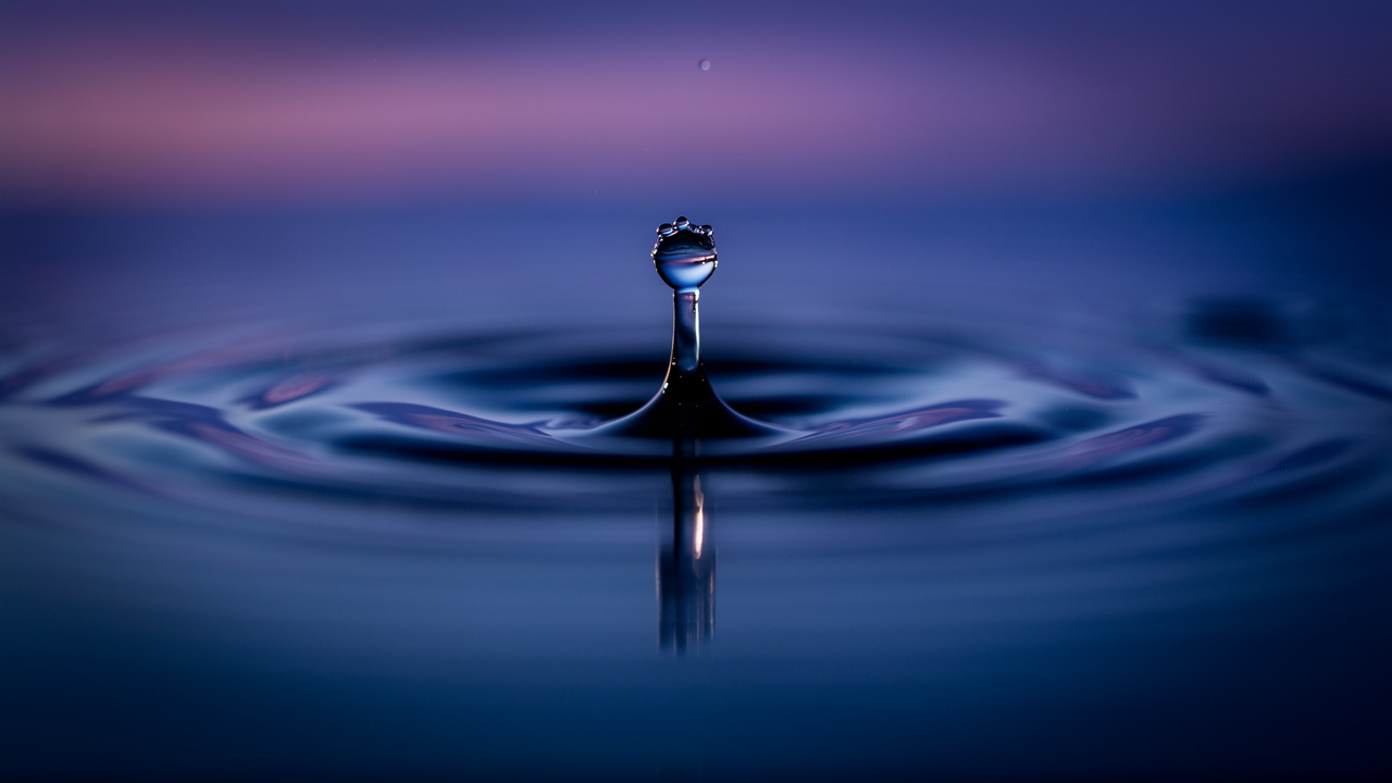 Water droplet creating ripples symbolizing circadian timing