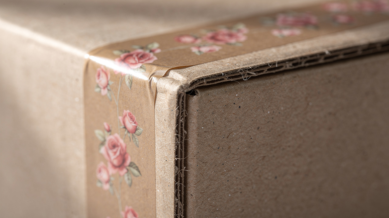 Sealed cardboard box with floral gummed tape