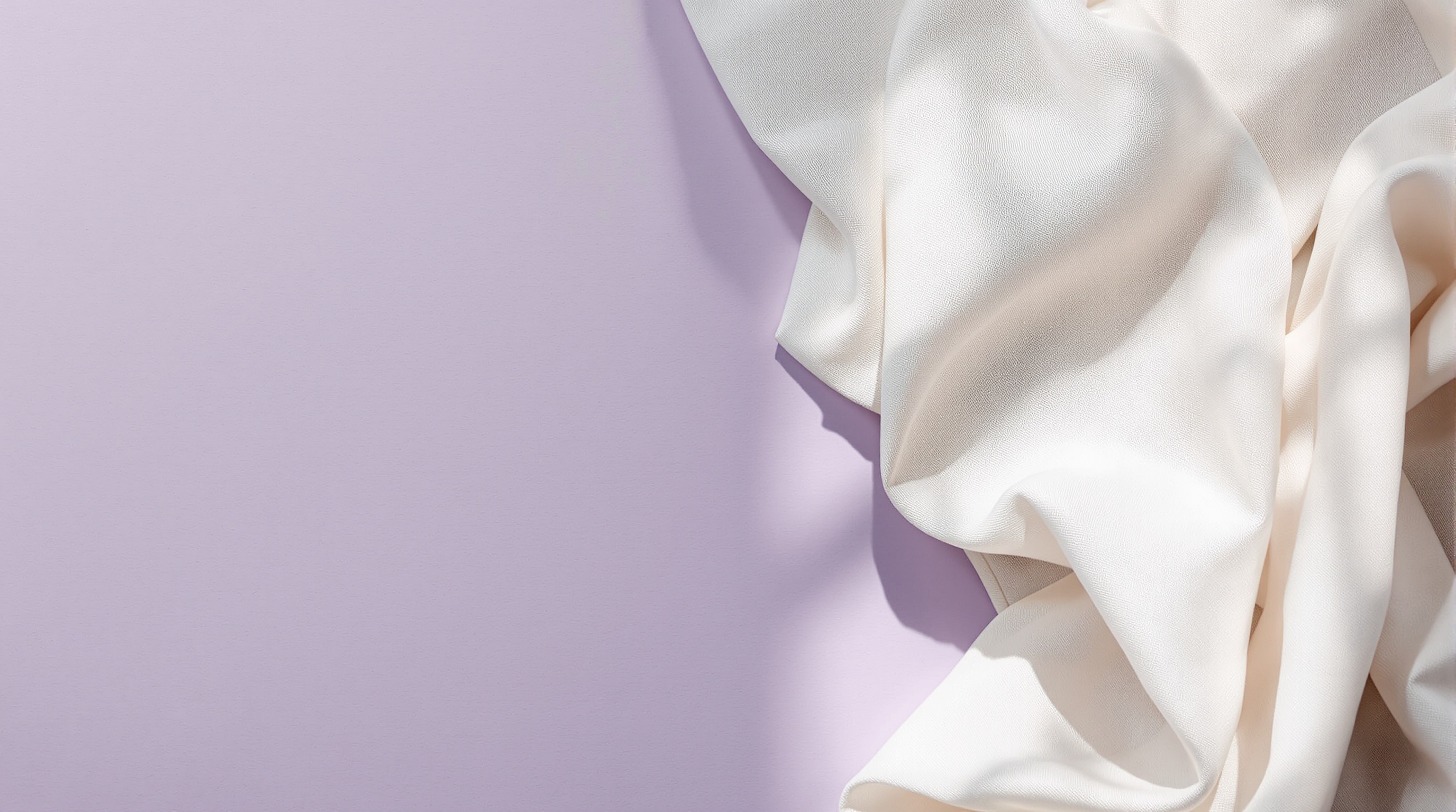 raw-linen-fabric-gently-folded-on-muted-lavender-ugv6ifcyaw