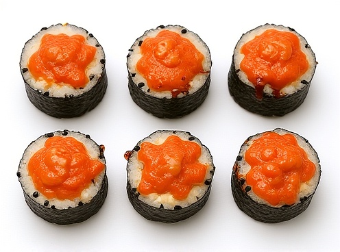 top-down-view-of-8-sushi-rolls-arranged-in-2-rows-5ht8diydfj