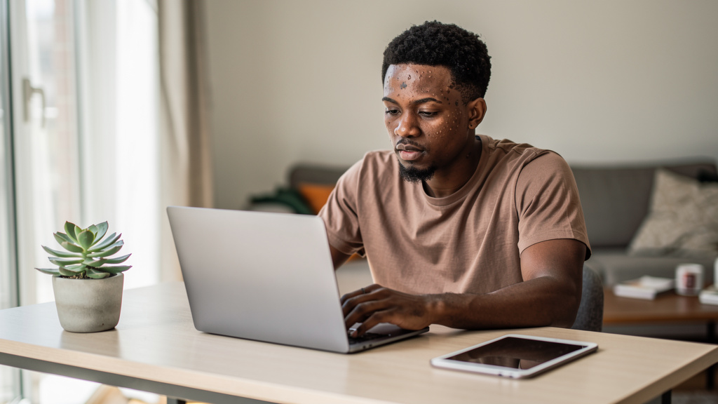 young freelancer working on laptop for how to use ai to start a youtube channel that makes money