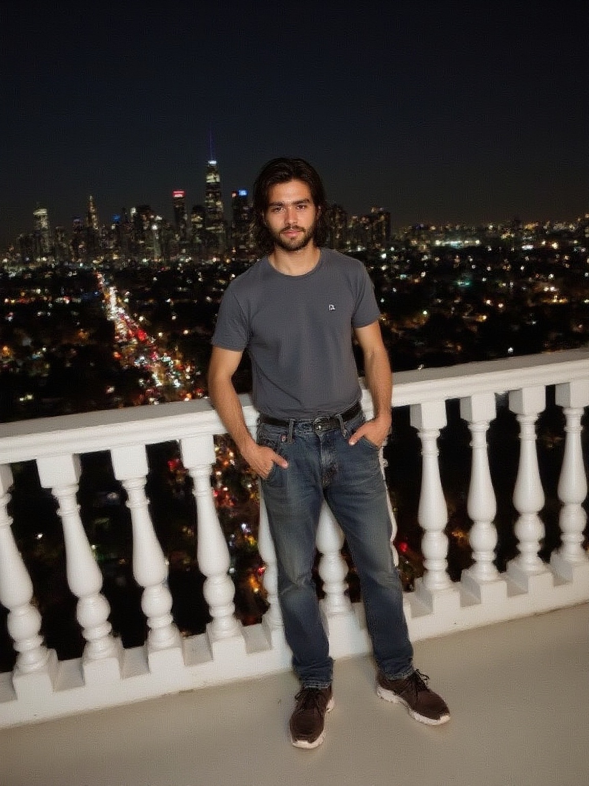 man-on-a-balcony-overlooking-la-skyline-with-a-lot-nlkbzsrvj