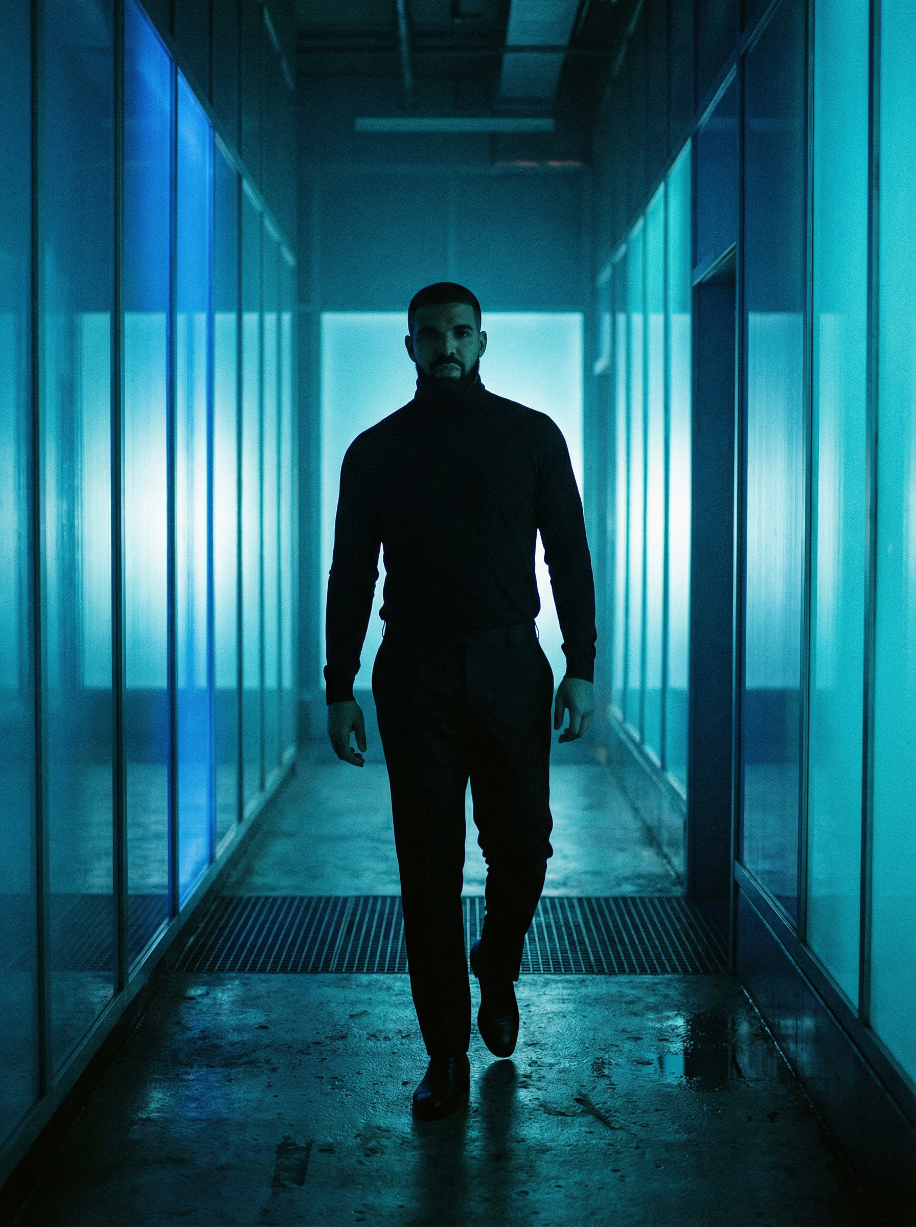 Silhouette framed in a deep blue neon corridor