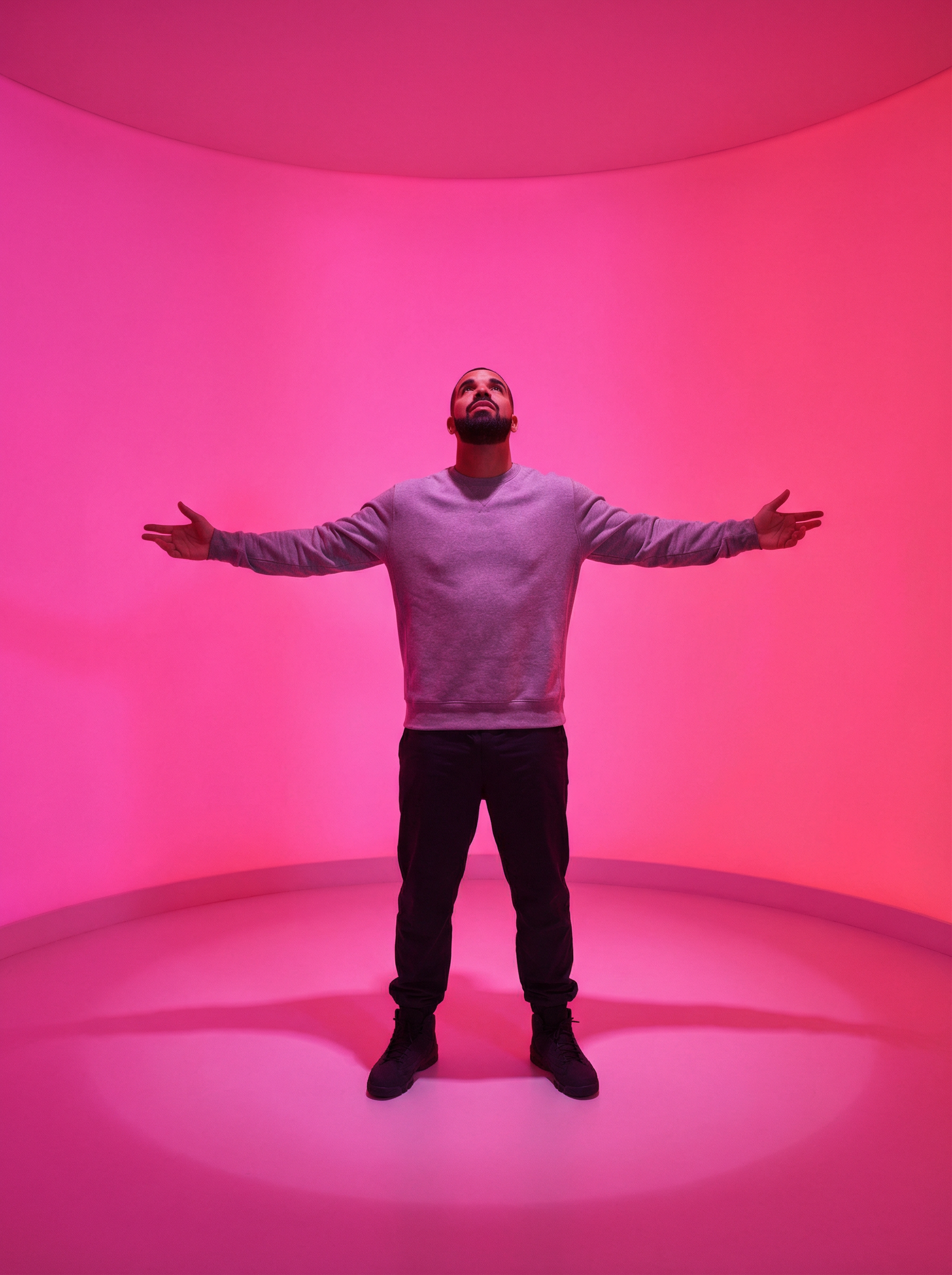 Arms spread wide in a hot pink glowing room