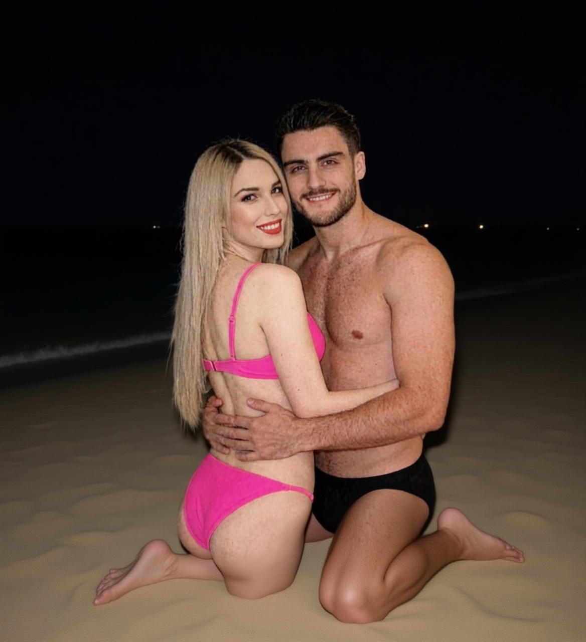 ellos-dos-en-la-arena-en-una-playa-de-noche-ella-3qam74yfsh