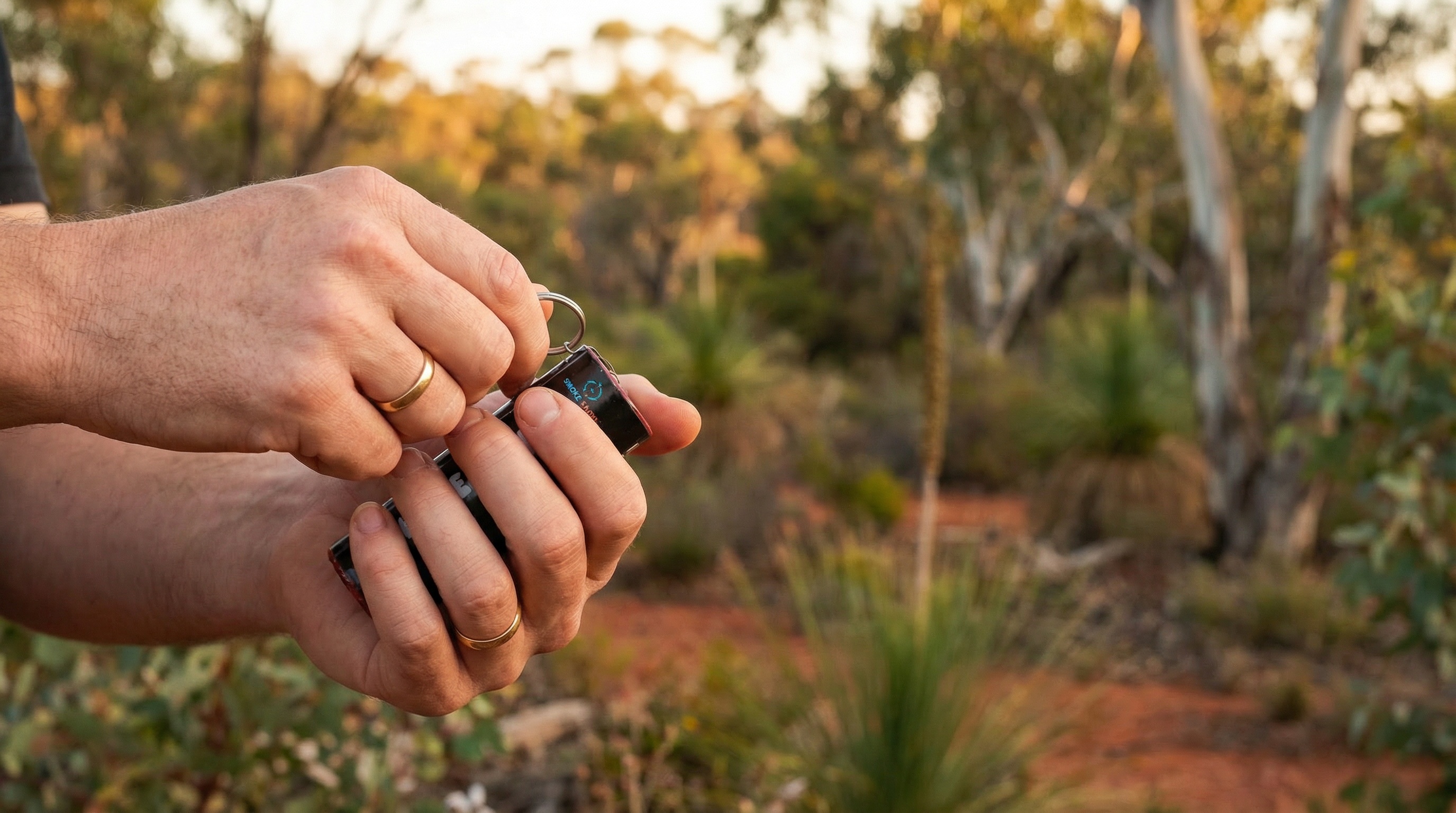 Close up hands holding gender reveal smoke bomb with activation instructions