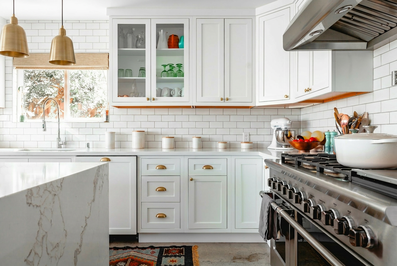 Reimagine this kitchen with white shaker cabinets, brass hardware, marble counte