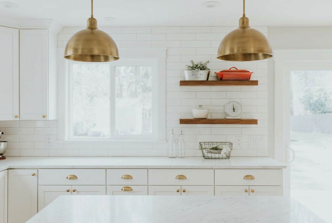 Reimagine this kitchen with white shaker cabinets, brass hardware, marble counte