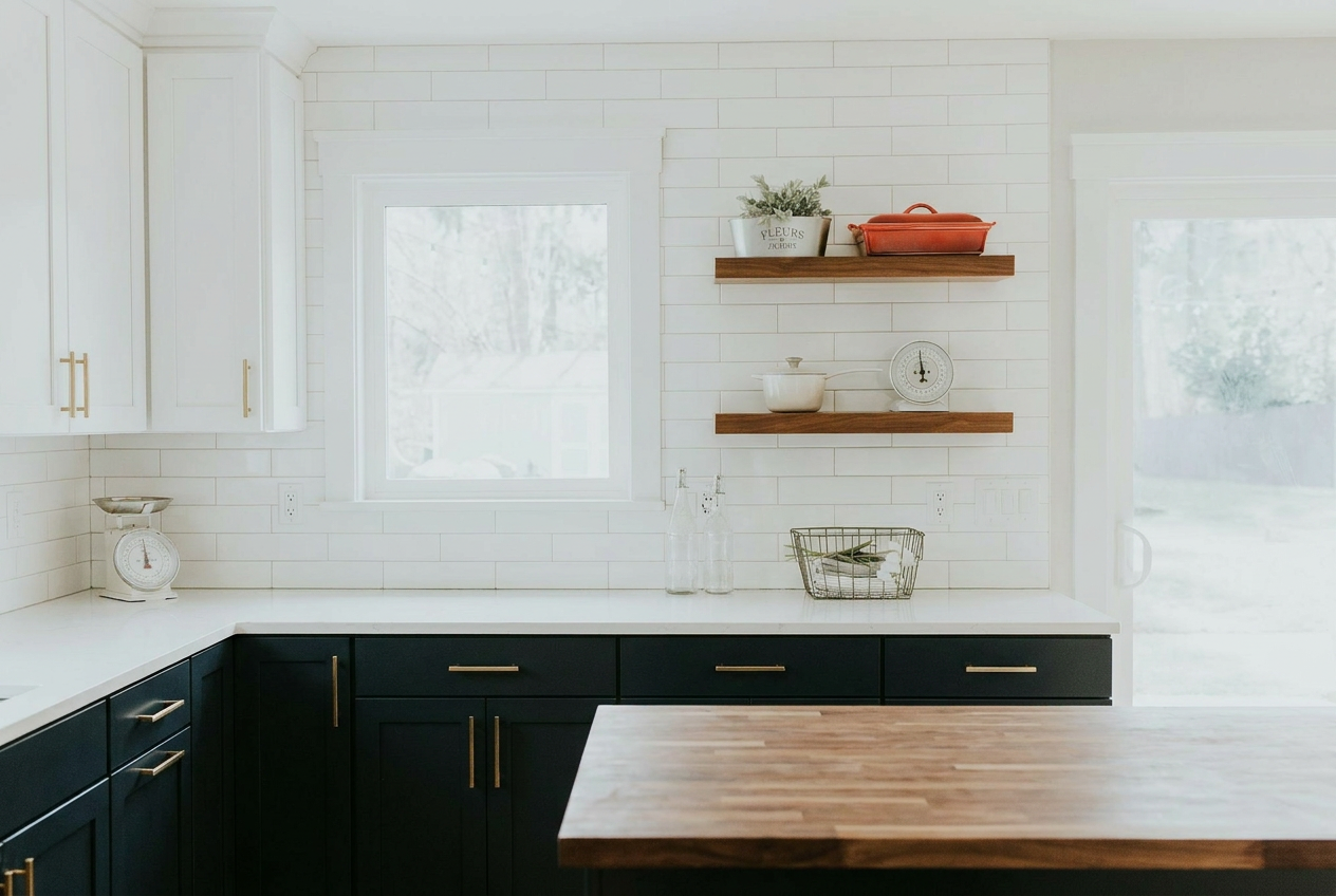 Reimagine this kitchen with dark navy lower cabinets, white upper cabinets, gold