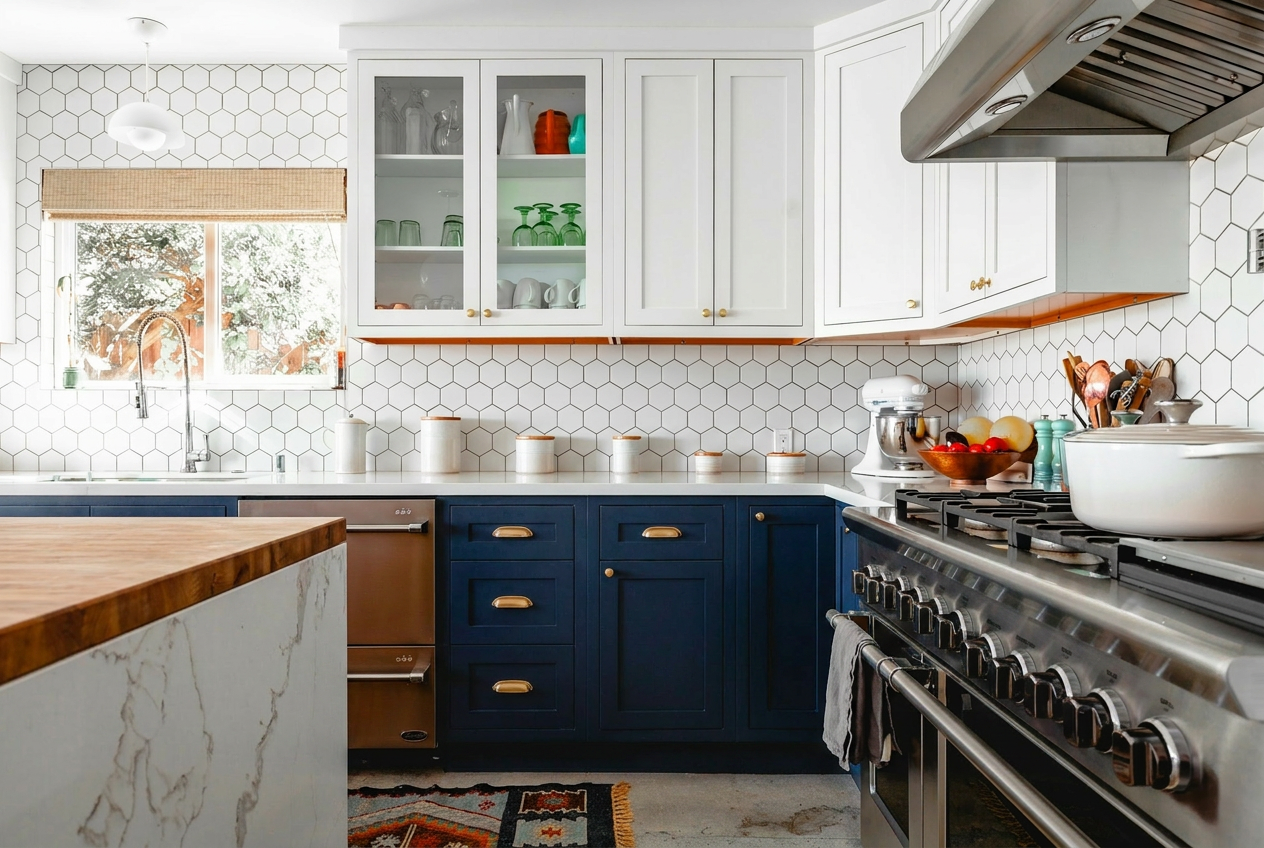 Reimagine this kitchen with dark navy lower cabinets, white upper cabinets, gold