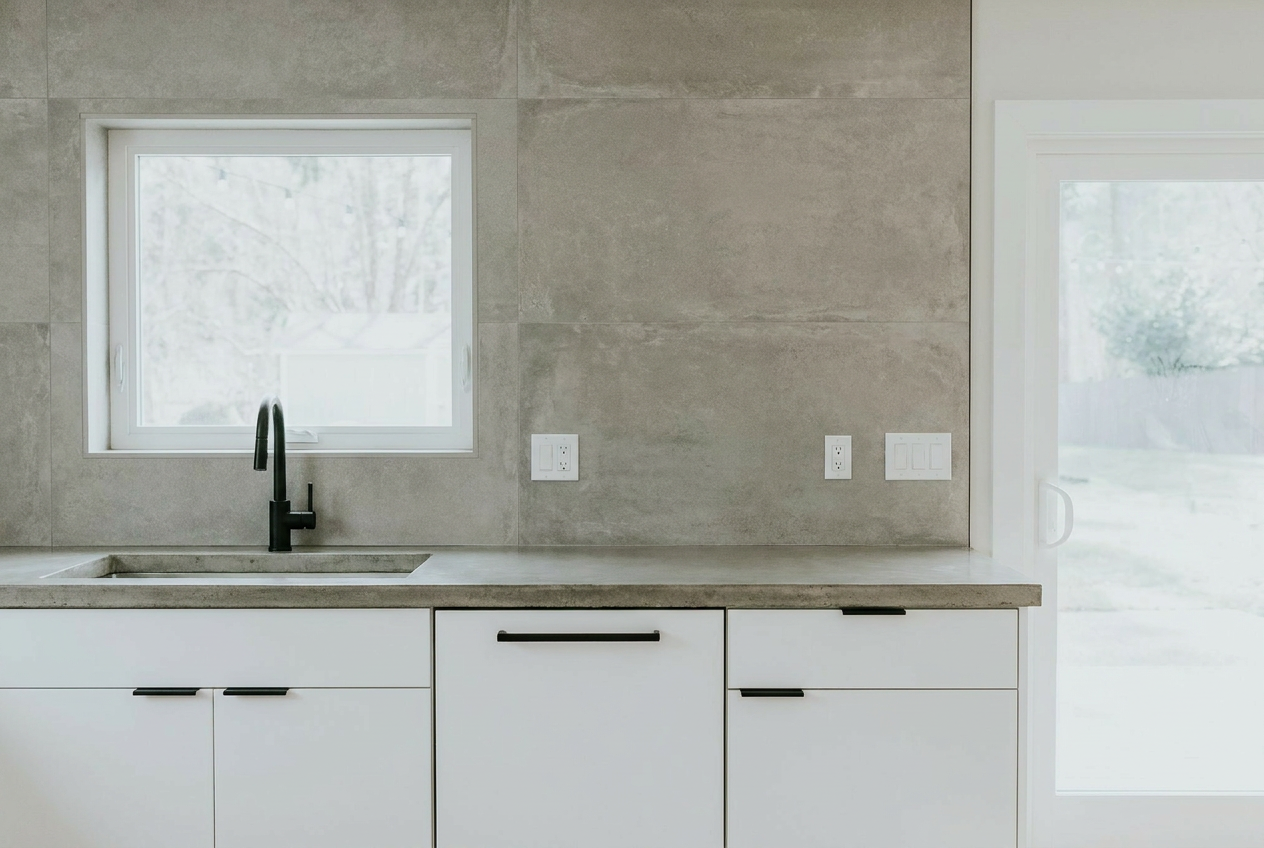 Reimagine this kitchen modern minimalist with flat-front white cabinets, black h