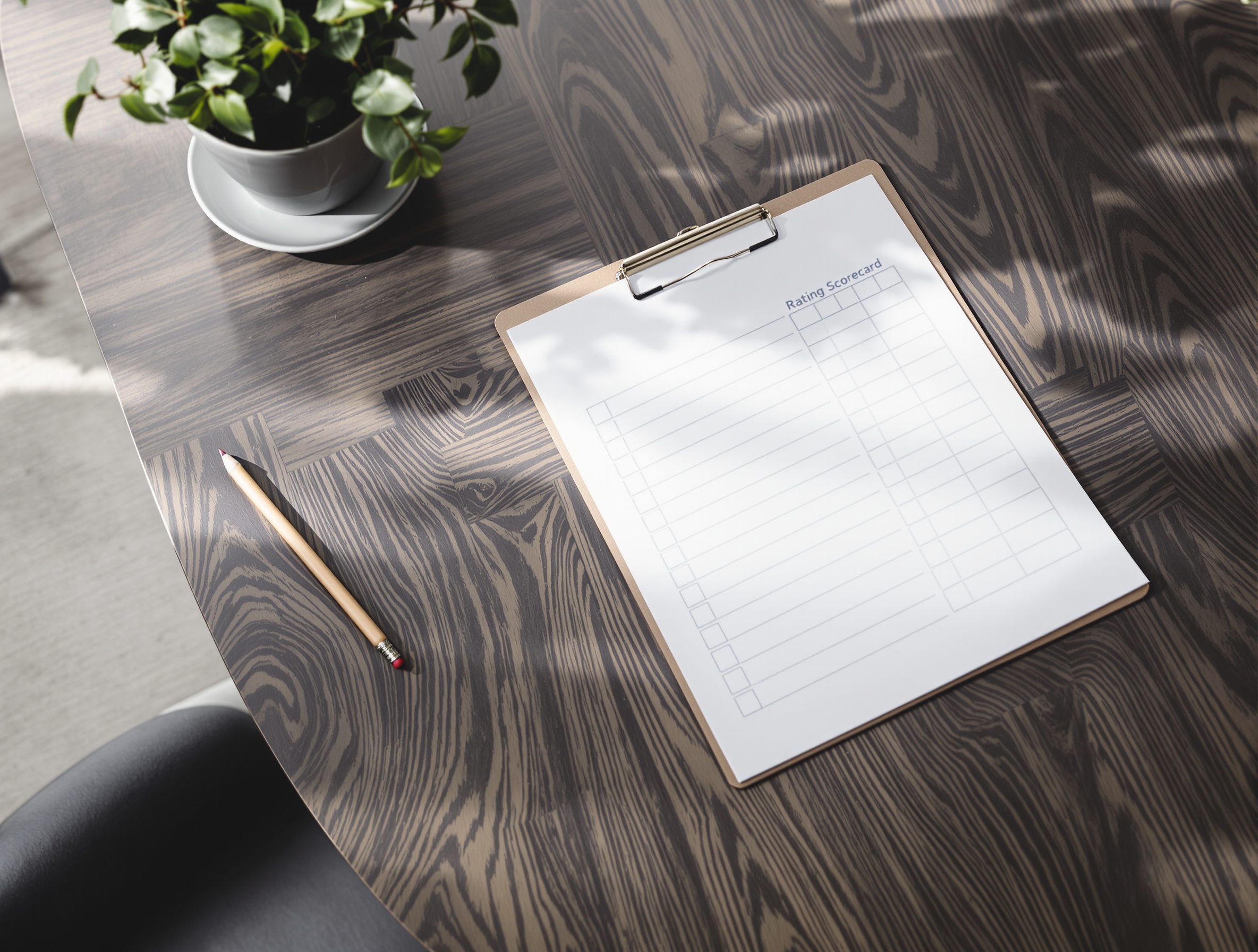 A physical scorecard sheet on a clipboard representing structured, evidence-based interview evaluation.