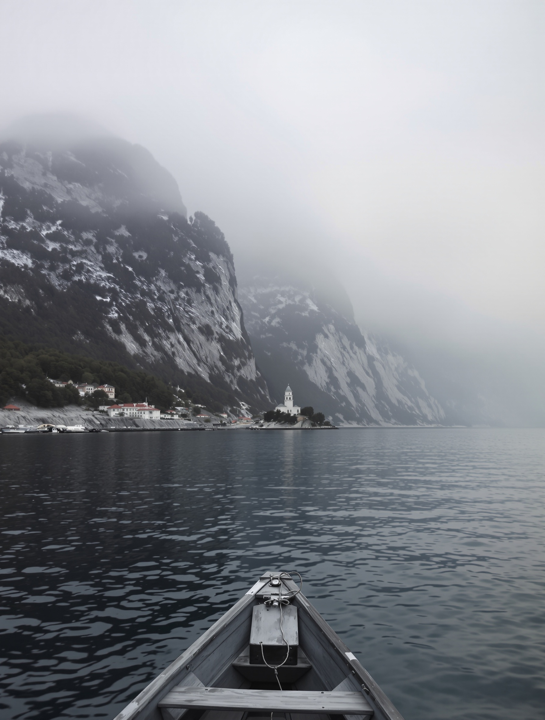 The Athos coastline seen from a wooden boat at grey dawn for Diamonitirion Elixir Atonit.