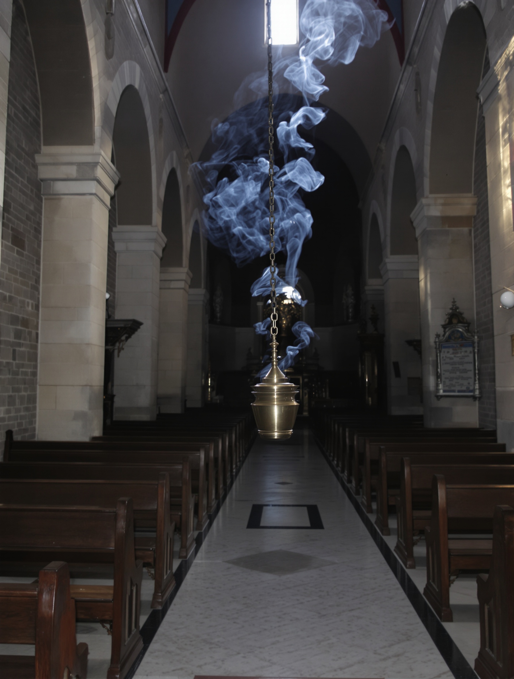 A dim Roman church nave photographed from the aisle floor, a brass thurible hanging mid-distance with incense smoke rising into a single shaft of cold clerestory light.