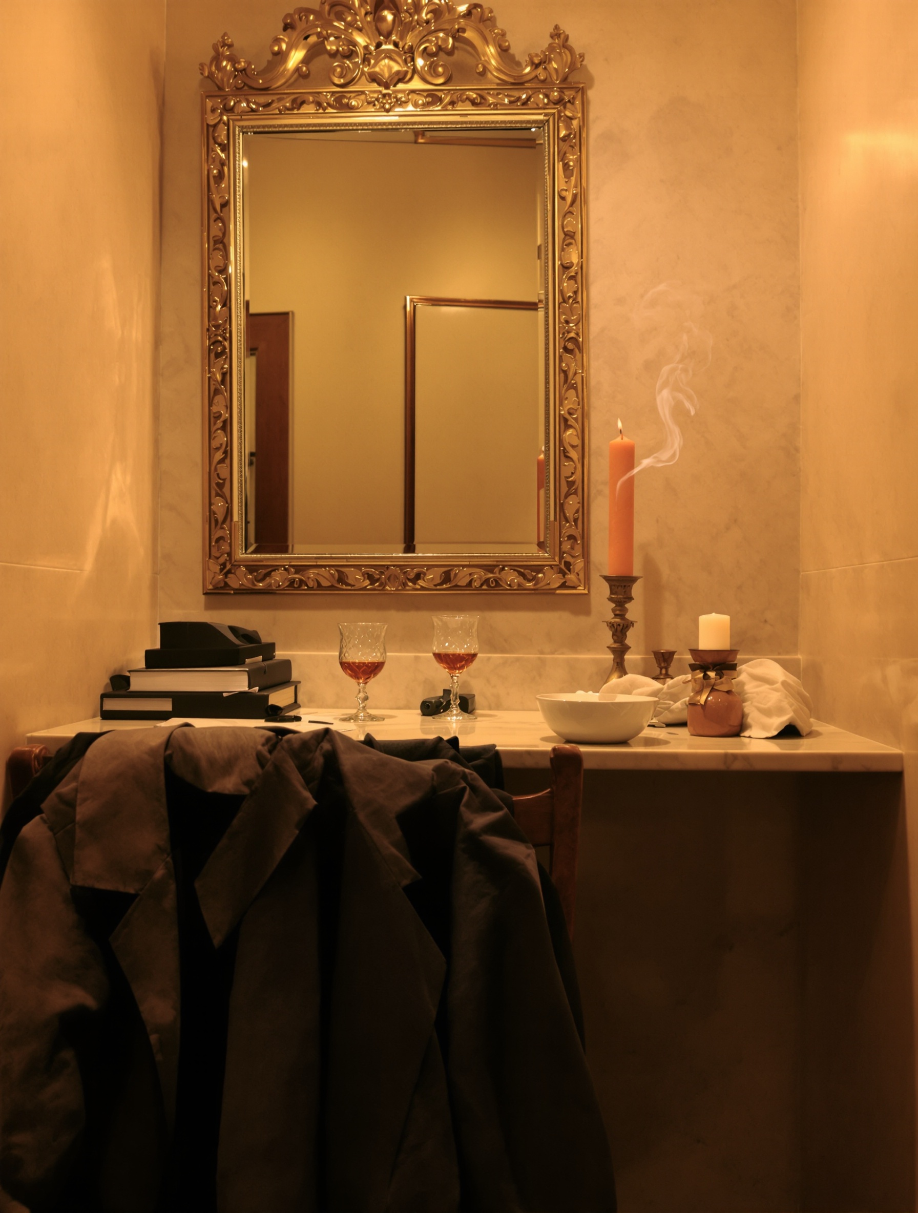A dimly lit backstage dressing room with cognac and powder, evoking the intimate grandeur of Roja Diaghilev.