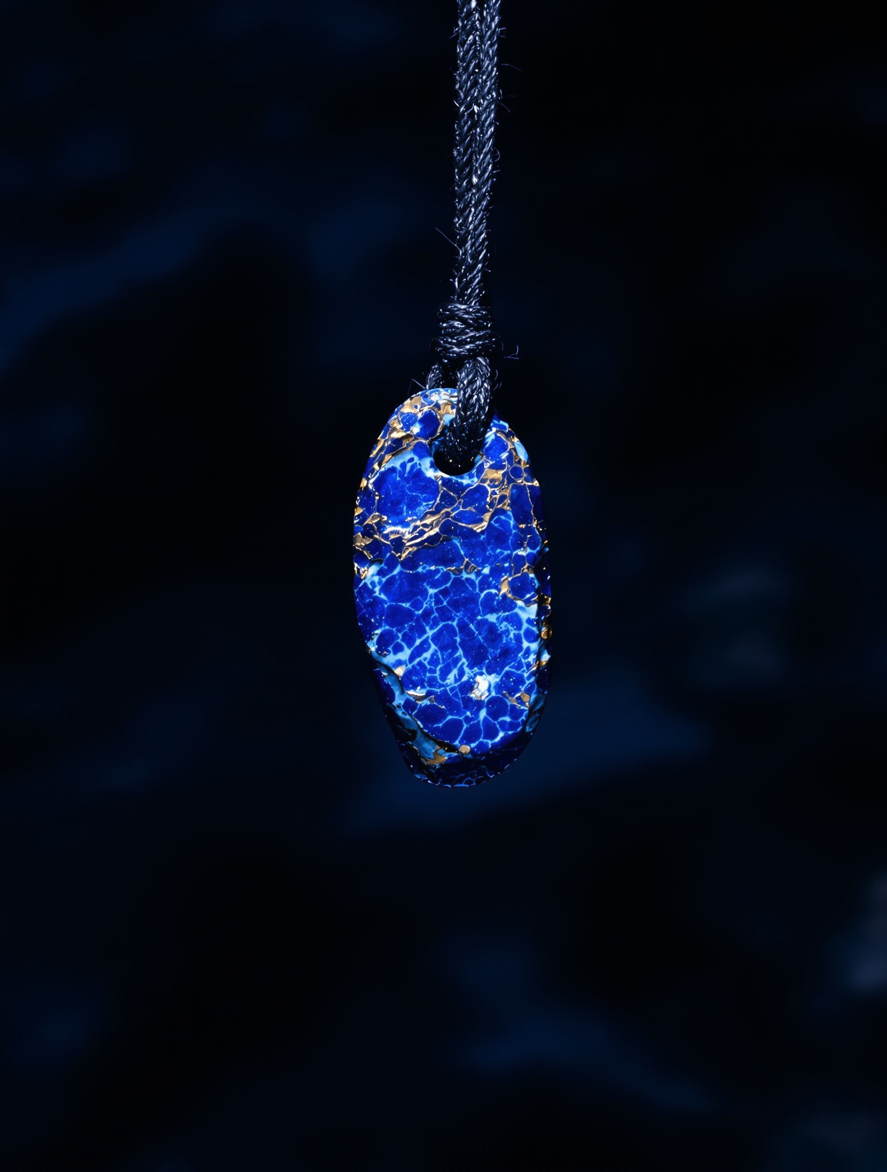 Hero frame for Blue Talisman Extrait by Ex Nihilo: a lapis lazuli amulet glowing against deep marine shadow.