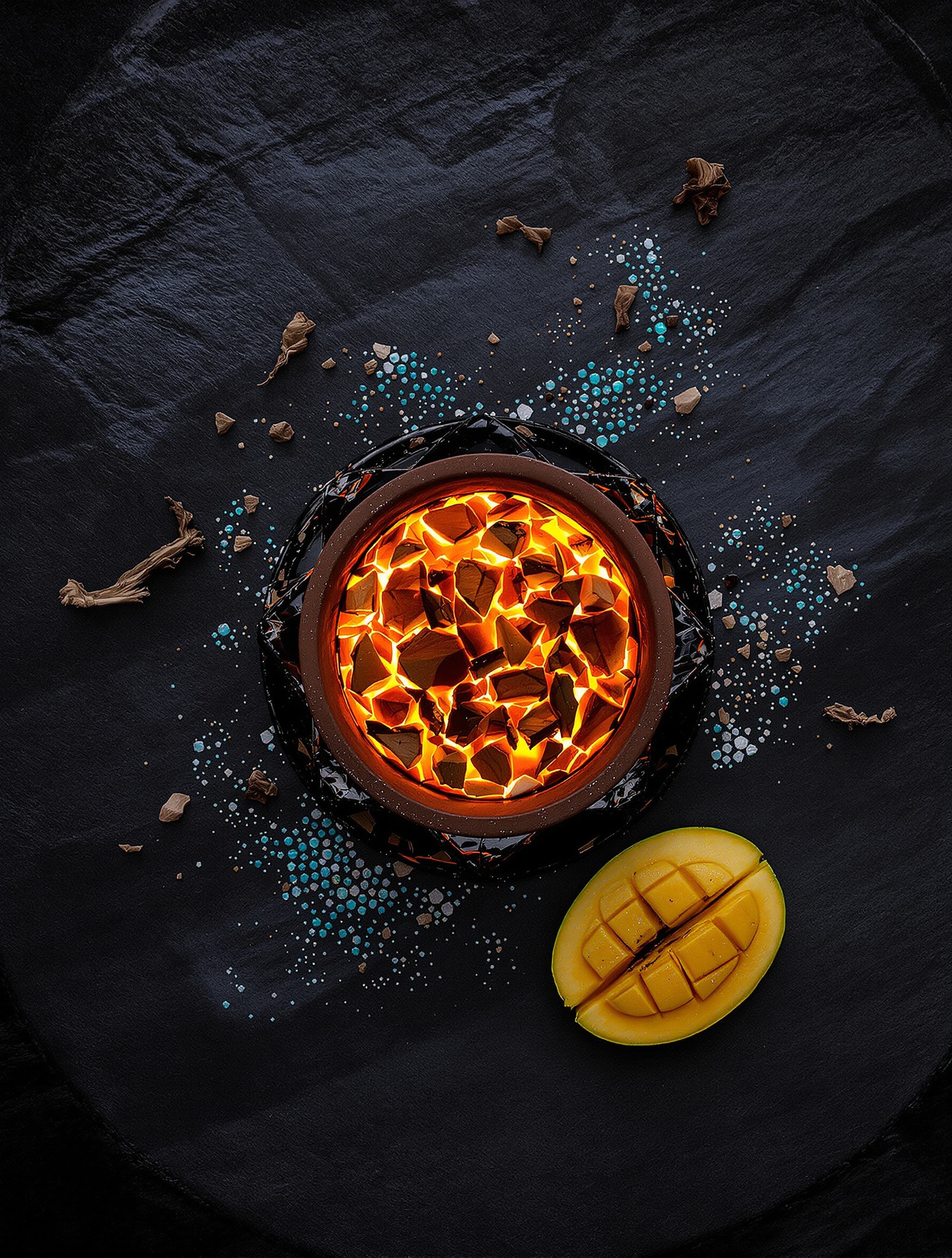 An overhead close-up of a carved basalt altar in a jungle clearing before sunrise, a split mango and glowing ember vessel at its center, turquoise inlay catching cold first light against deep shadow, evoking the sacred ritual heart of 777 God of Fire by Stéphane Humbert Lucas.