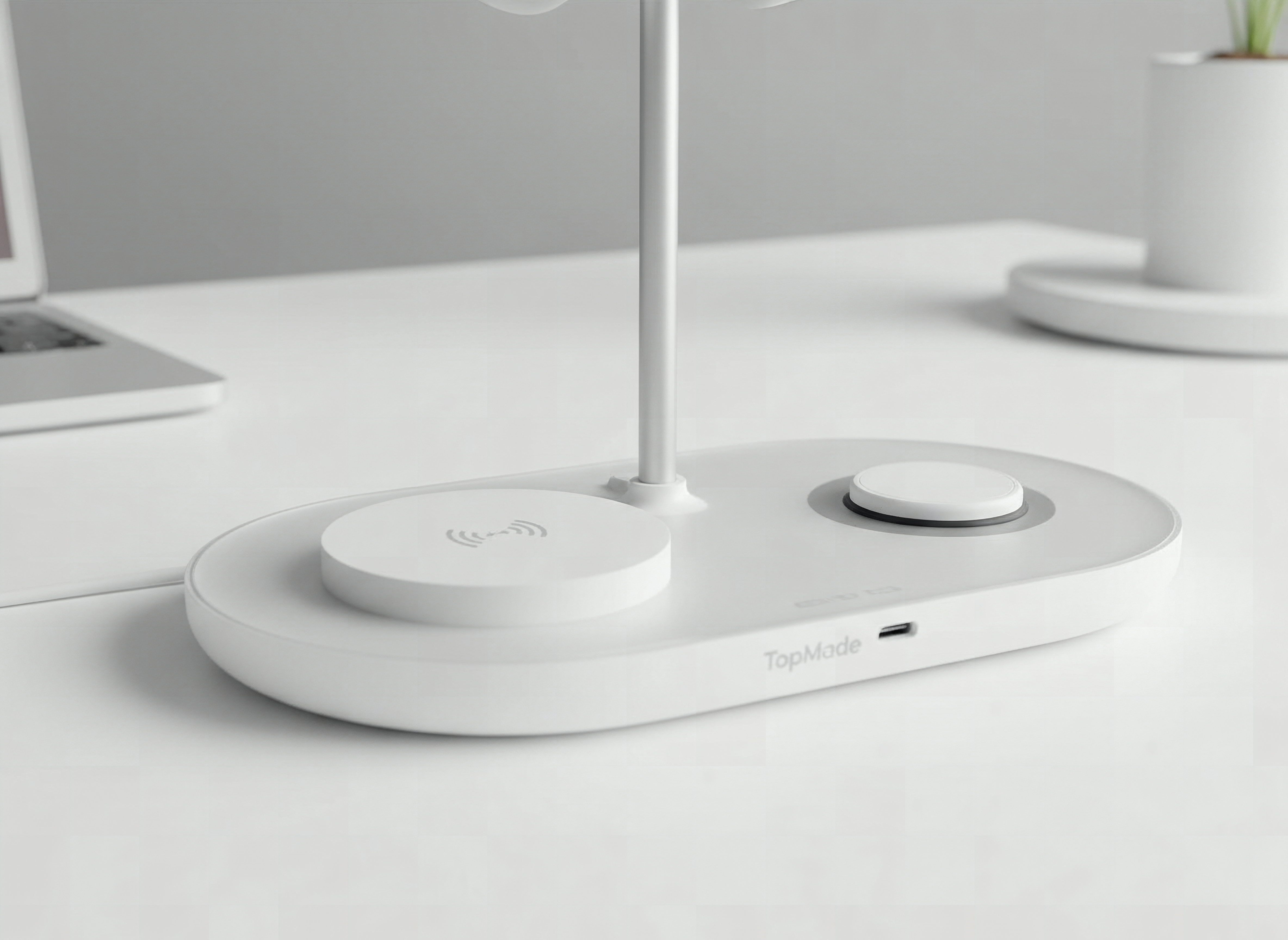 Close-up of TopMade charger stand's 15W wireless charging pad and connector ports with white finish