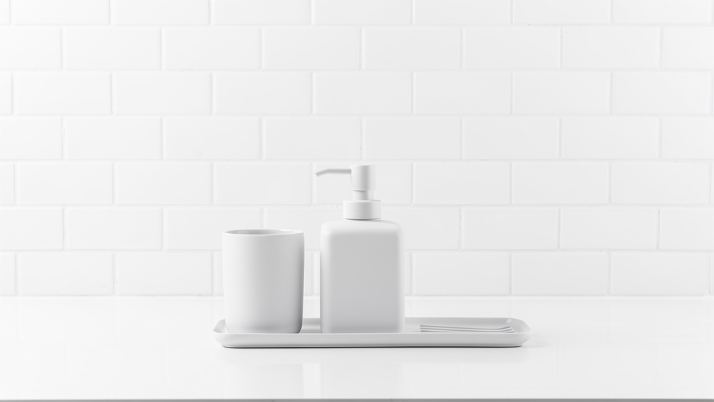 A modern bathroom accessory holder set against a tile wall
