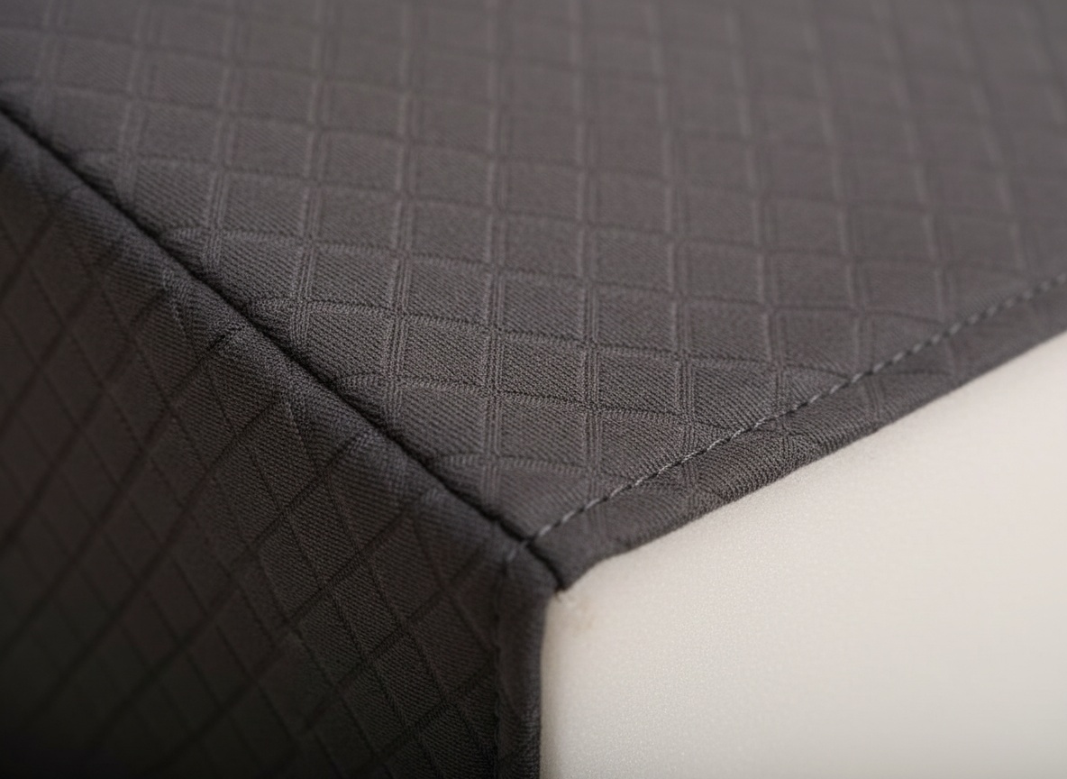 Close-up of Kolbs bed wedge pillow showing jacquard fabric texture and side stitching detail