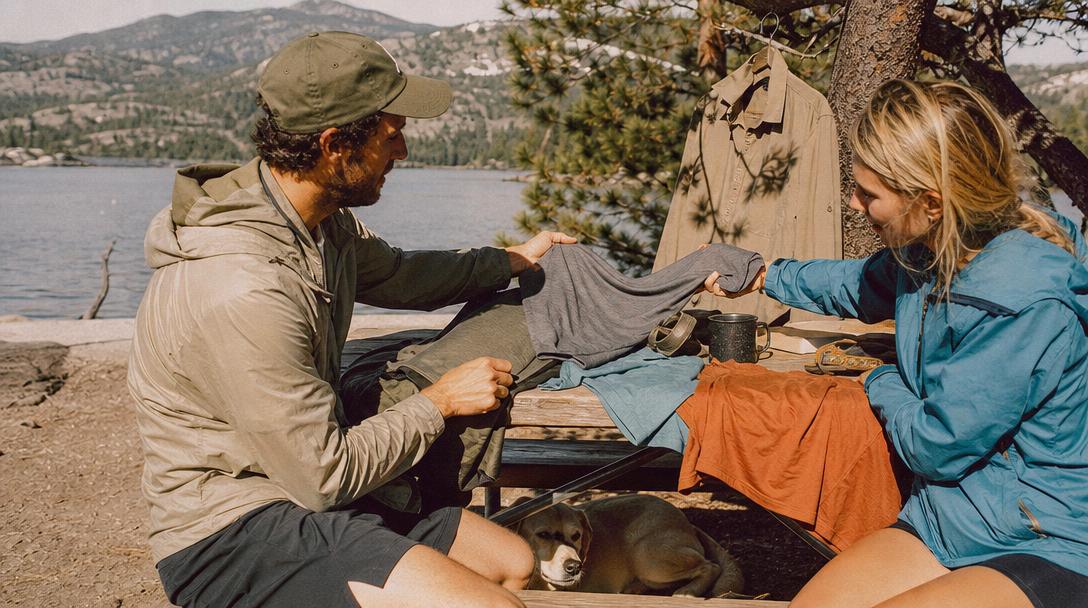 Back of van with hiking shirts hanging to dry on a line