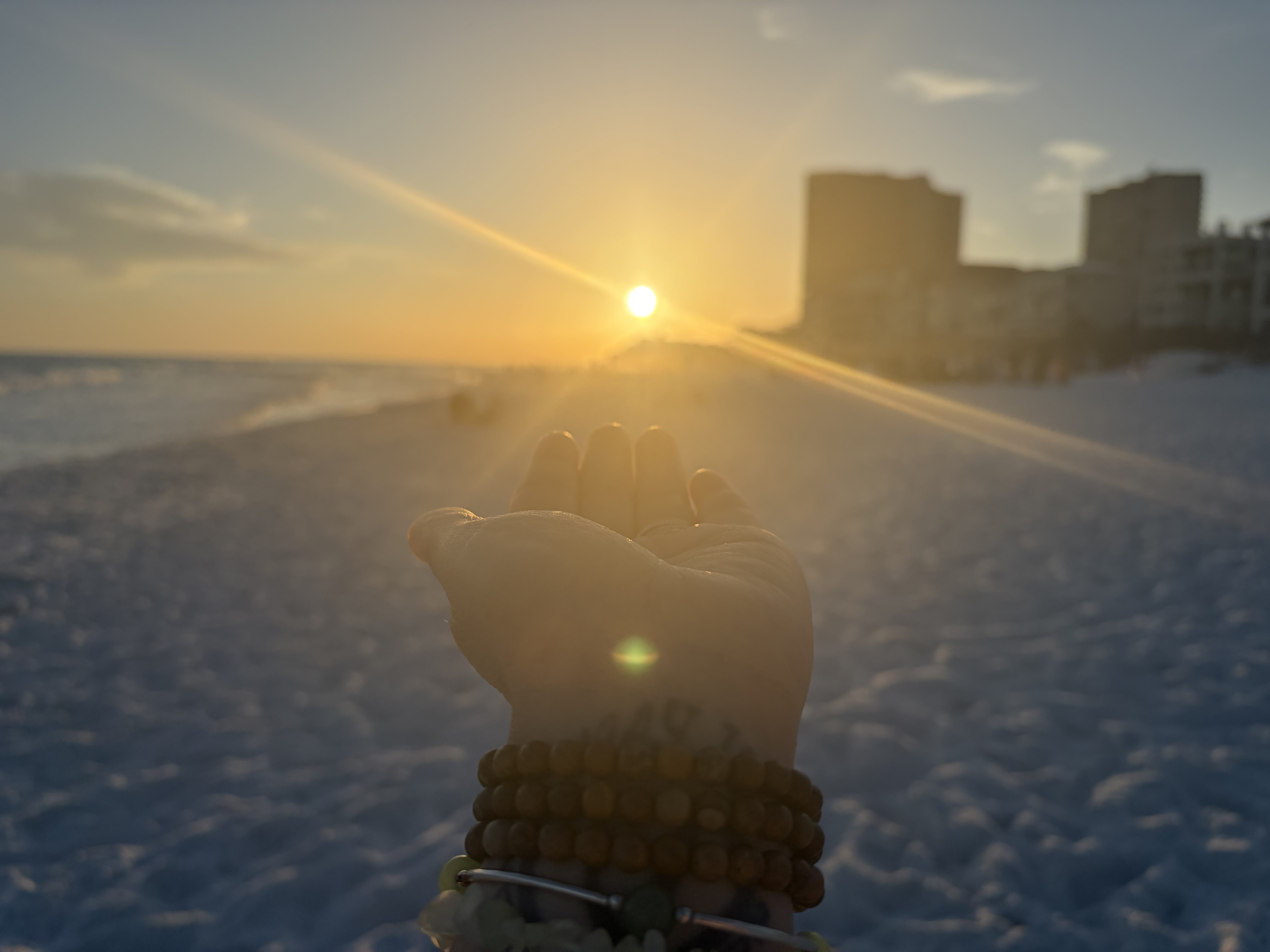 Hands holding the morning sun