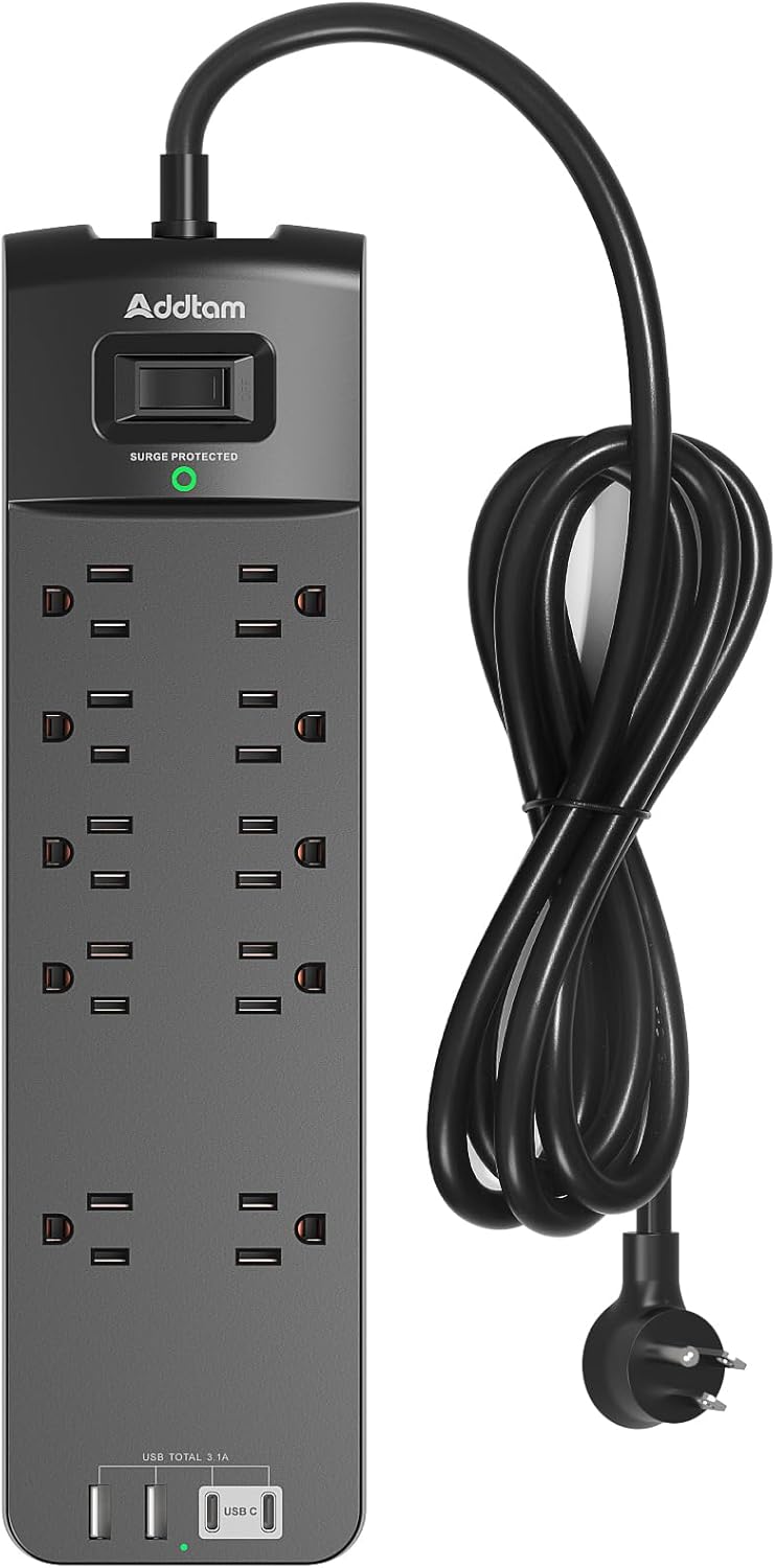 Macro close-up of Addtam power strip outlets and USB ports with selective focus on the socket details