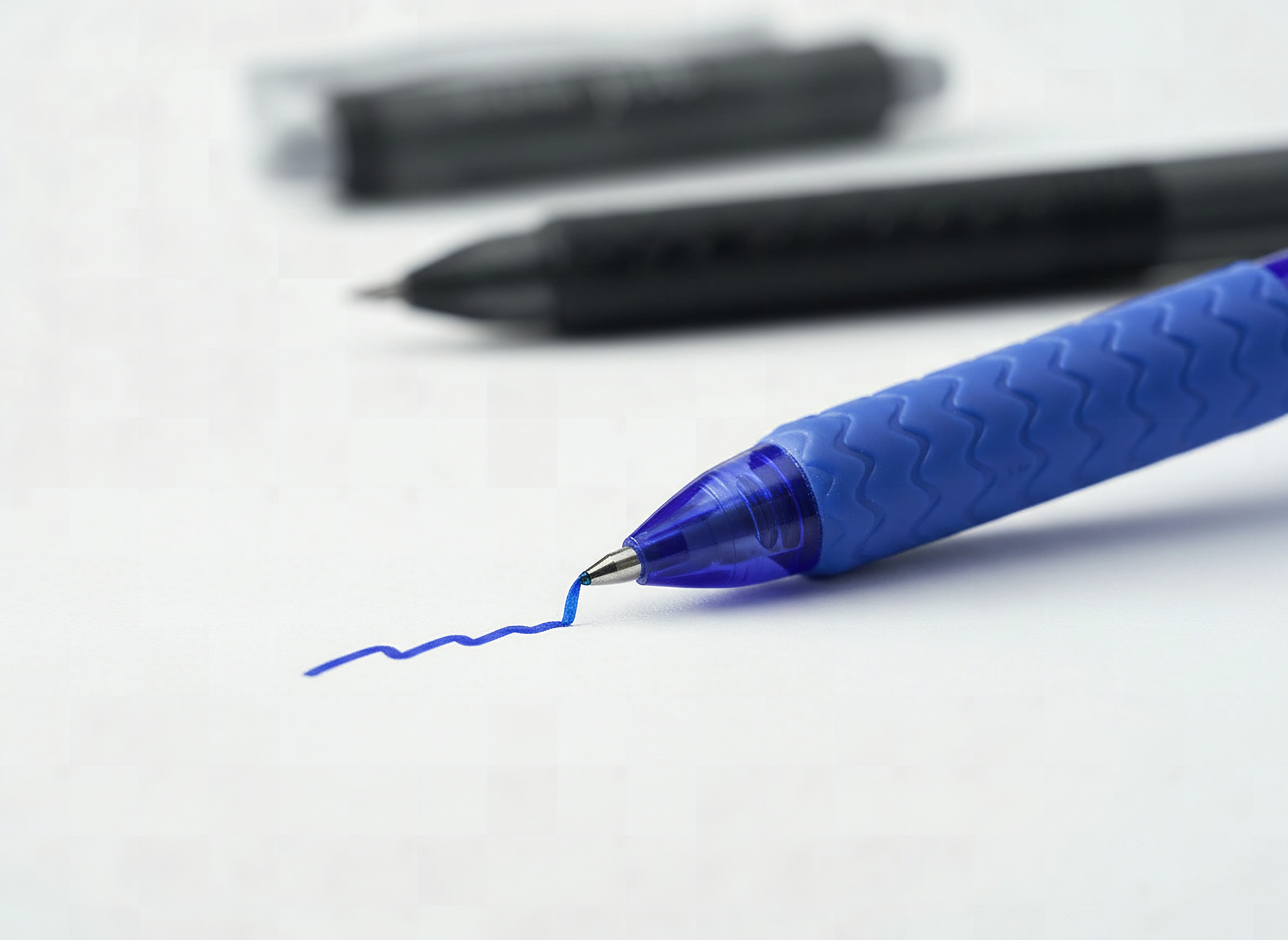 Lineon erasable gel pen nib writing on paper in macro detail with shallow focus