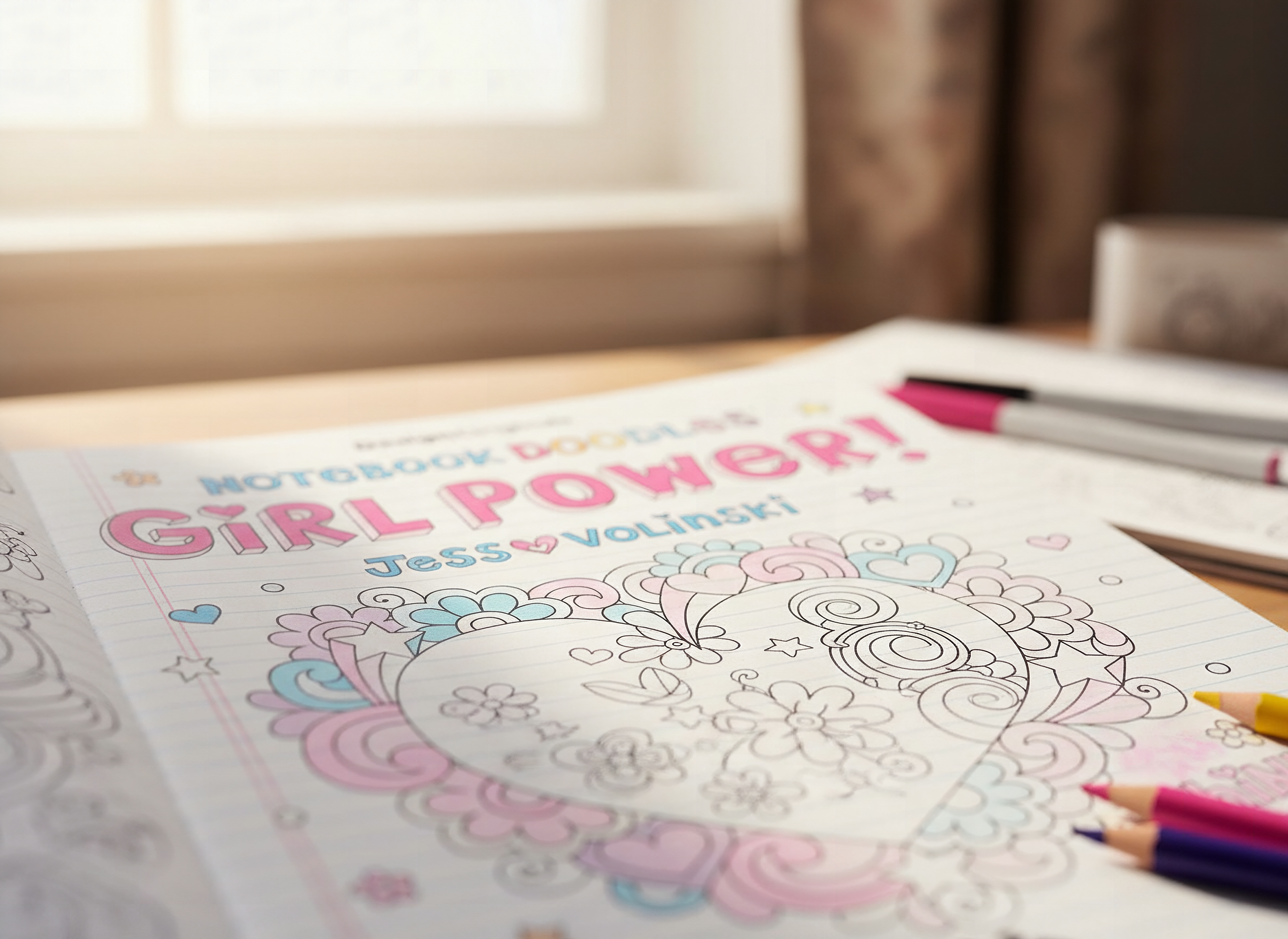Close-up of Girl Power coloring book open to a detailed activity page with colored pencils nearby