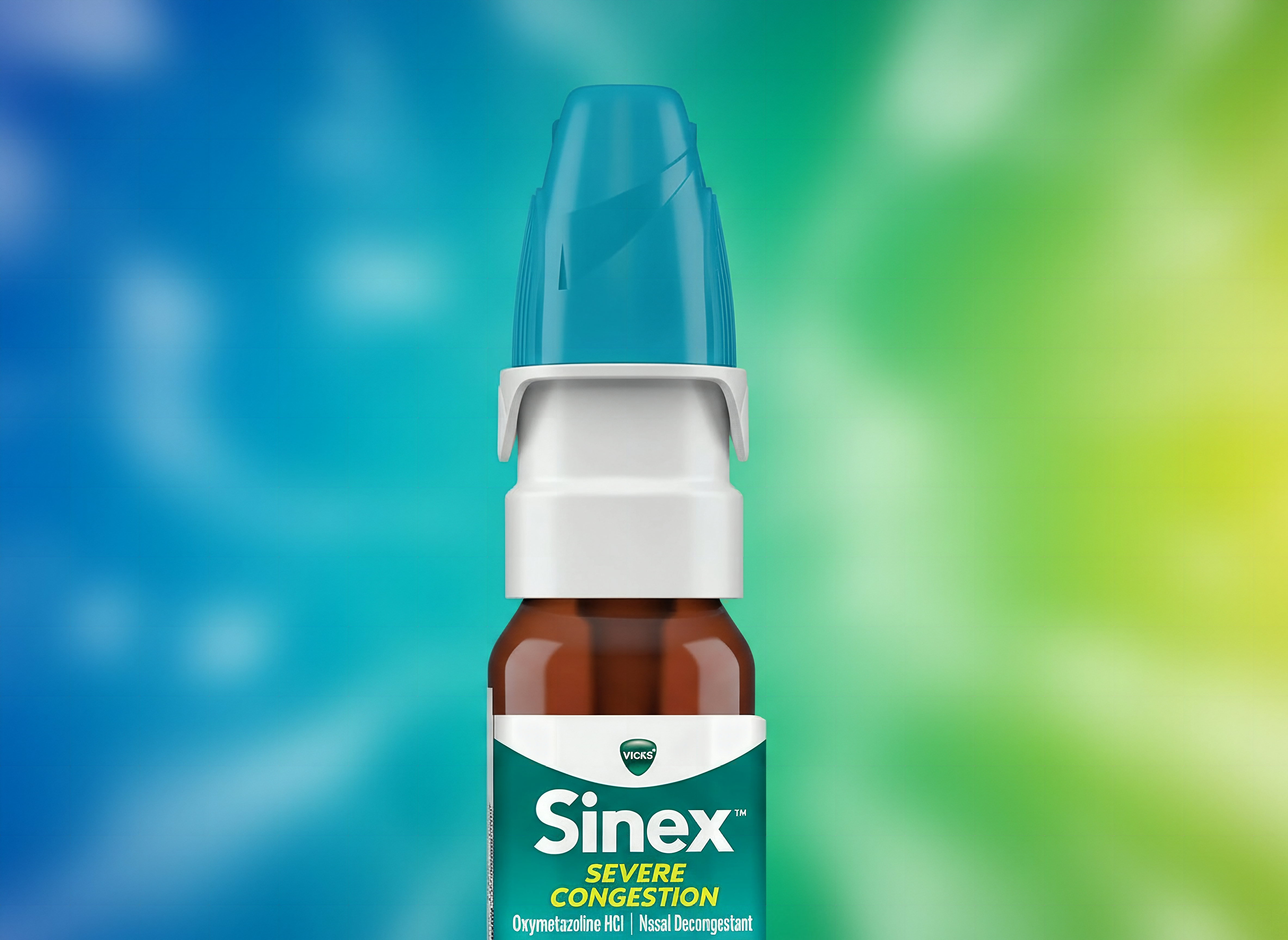 Macro close-up of Vicks Sinex Severe spray bottle nozzle and pump mechanism with shallow focus