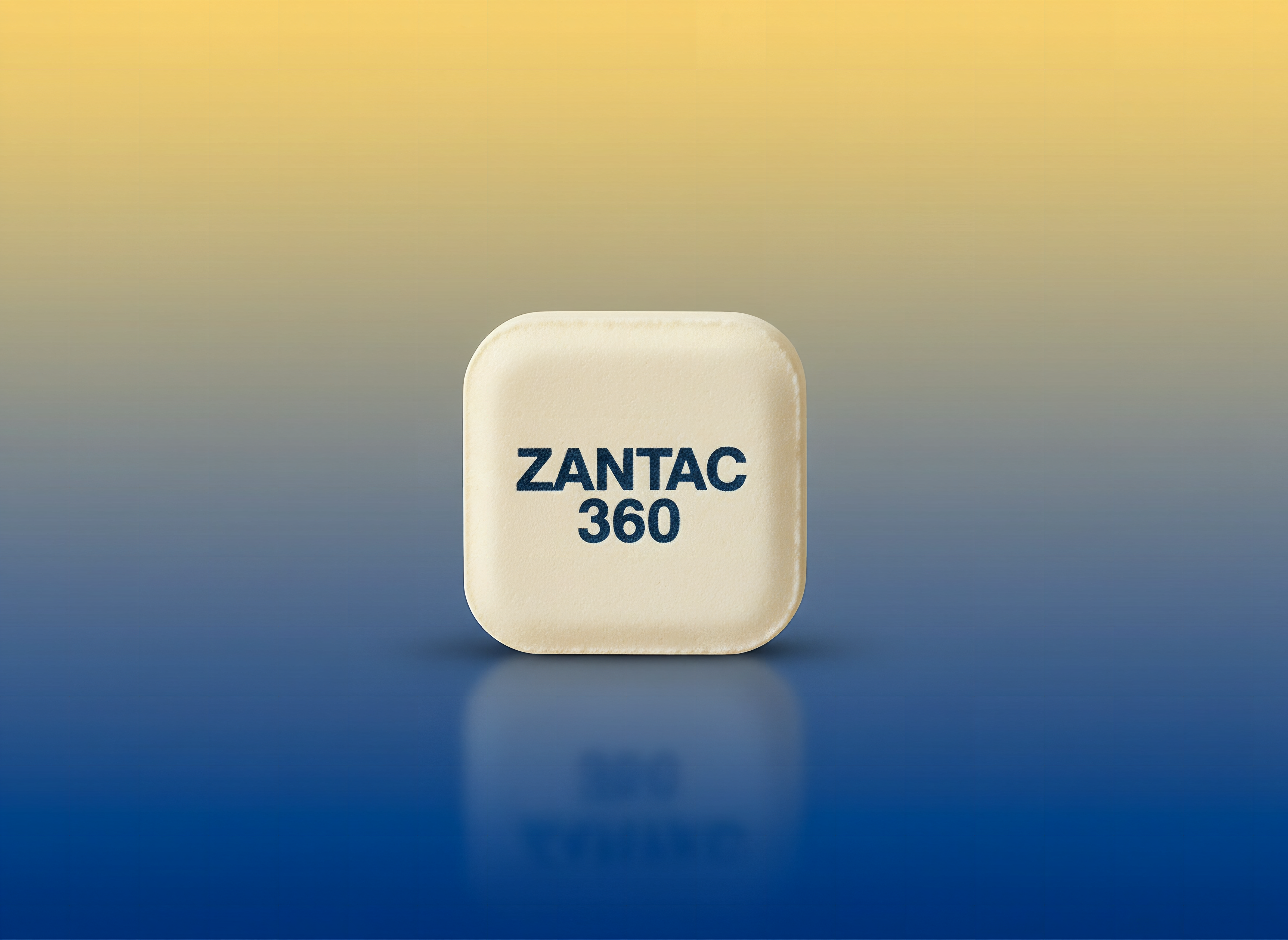 Single Zantac 360 Maximum Strength tablet in extreme close-up, sharp detail against soft blurred background