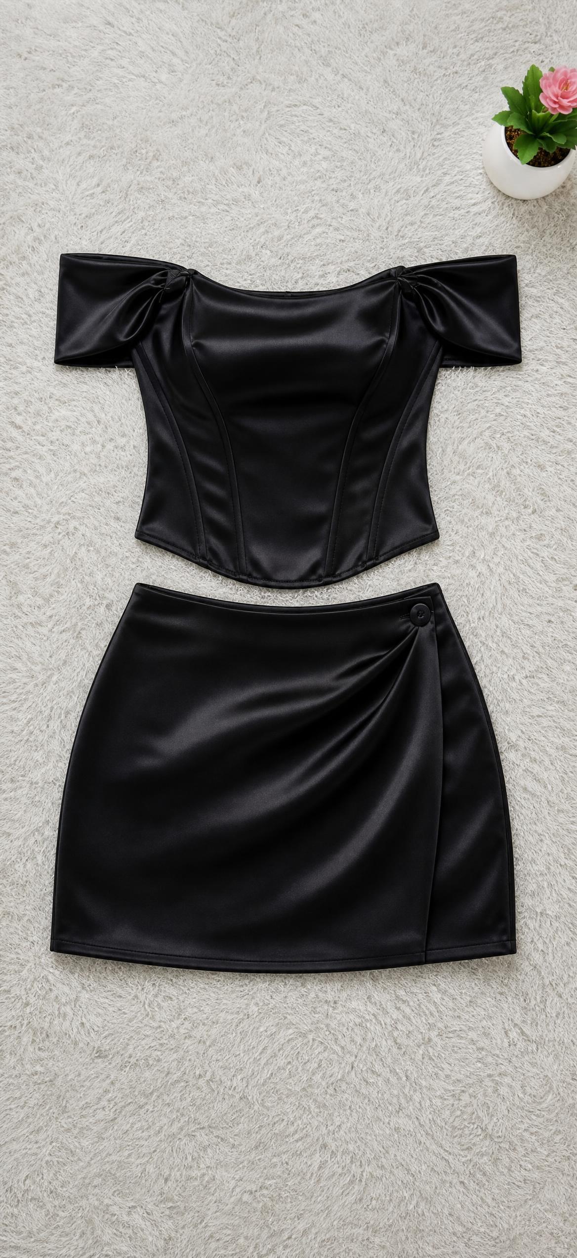 Black glossy off-shoulder corset top with puff sleeves — Vinted listing photo example