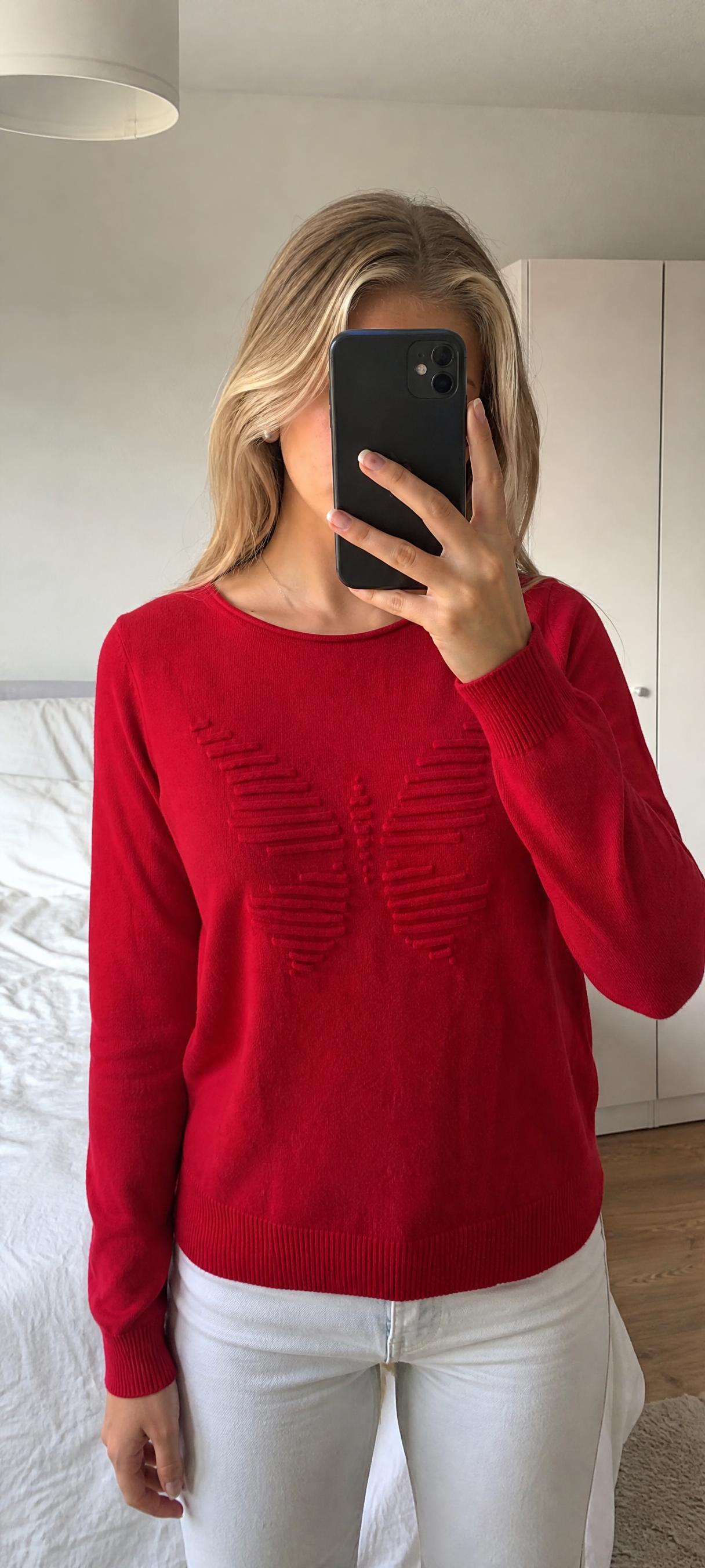 Red knit jumper with raised butterfly motif