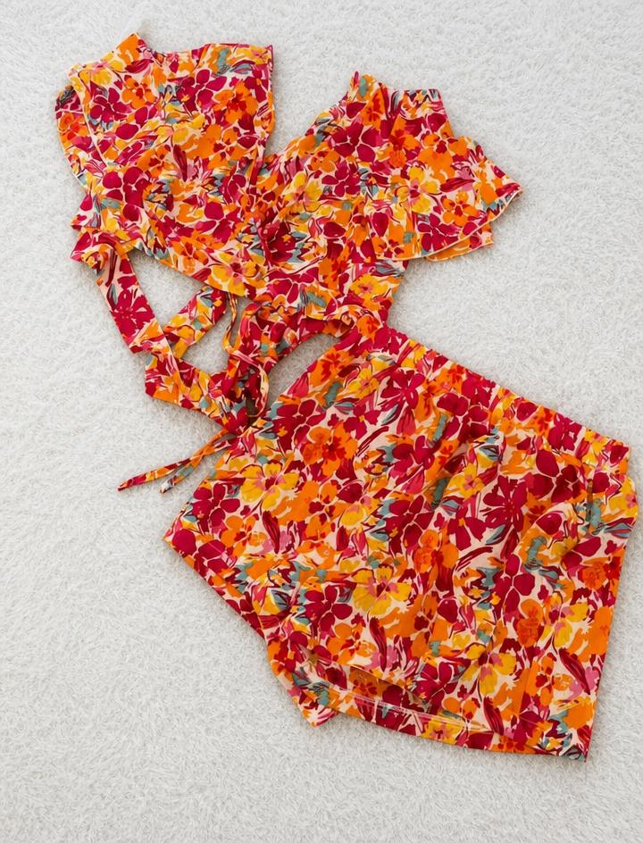 Floral playsuit with tie straps – very good condition