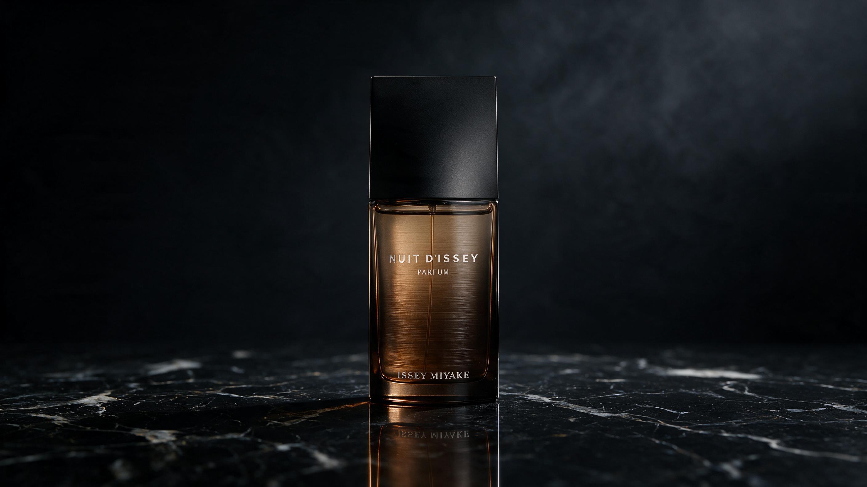professional product photography of an elegant dark amber glass perfume bottle with a matte black cap, standing on polis
