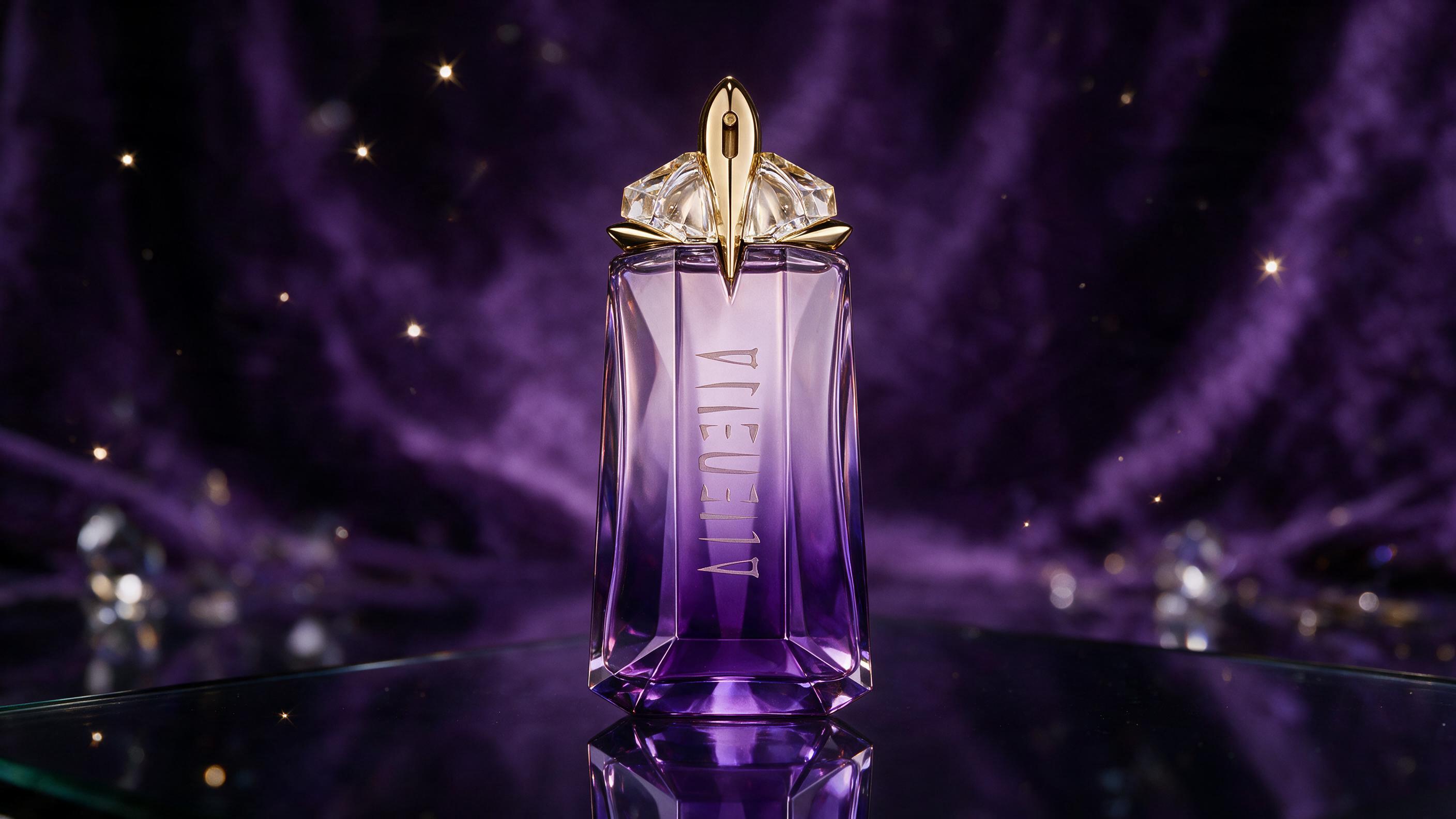 elegant amethyst purple star-shaped perfume bottle with gold star cap, Thierry Mugler Alien Goddess Intense style, stand