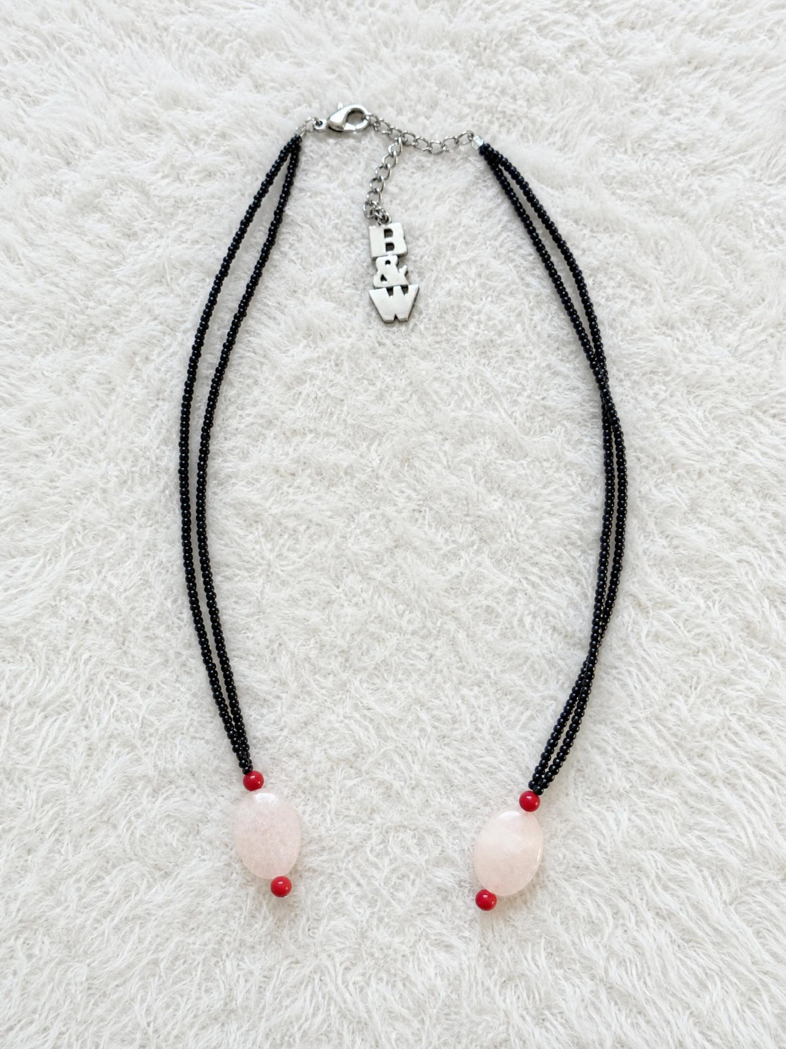 Black Beaded Necklace with Pink Stone Pendant