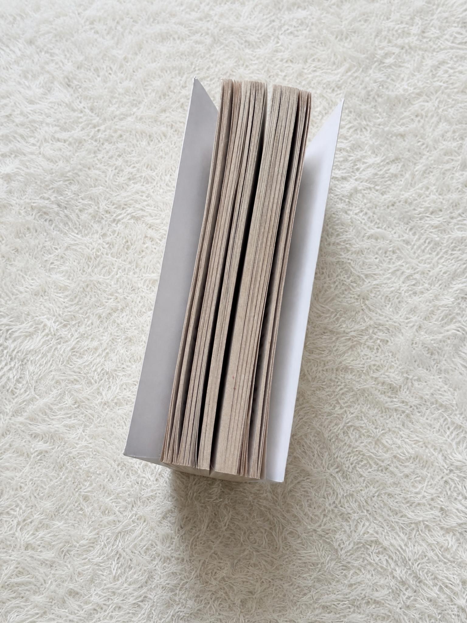 Paperback book with aged page edges and red ink marks