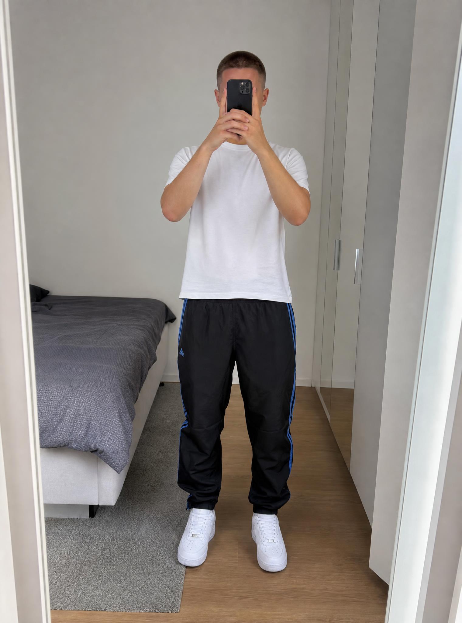 Adidas black track pants with blue stripes, very good condition