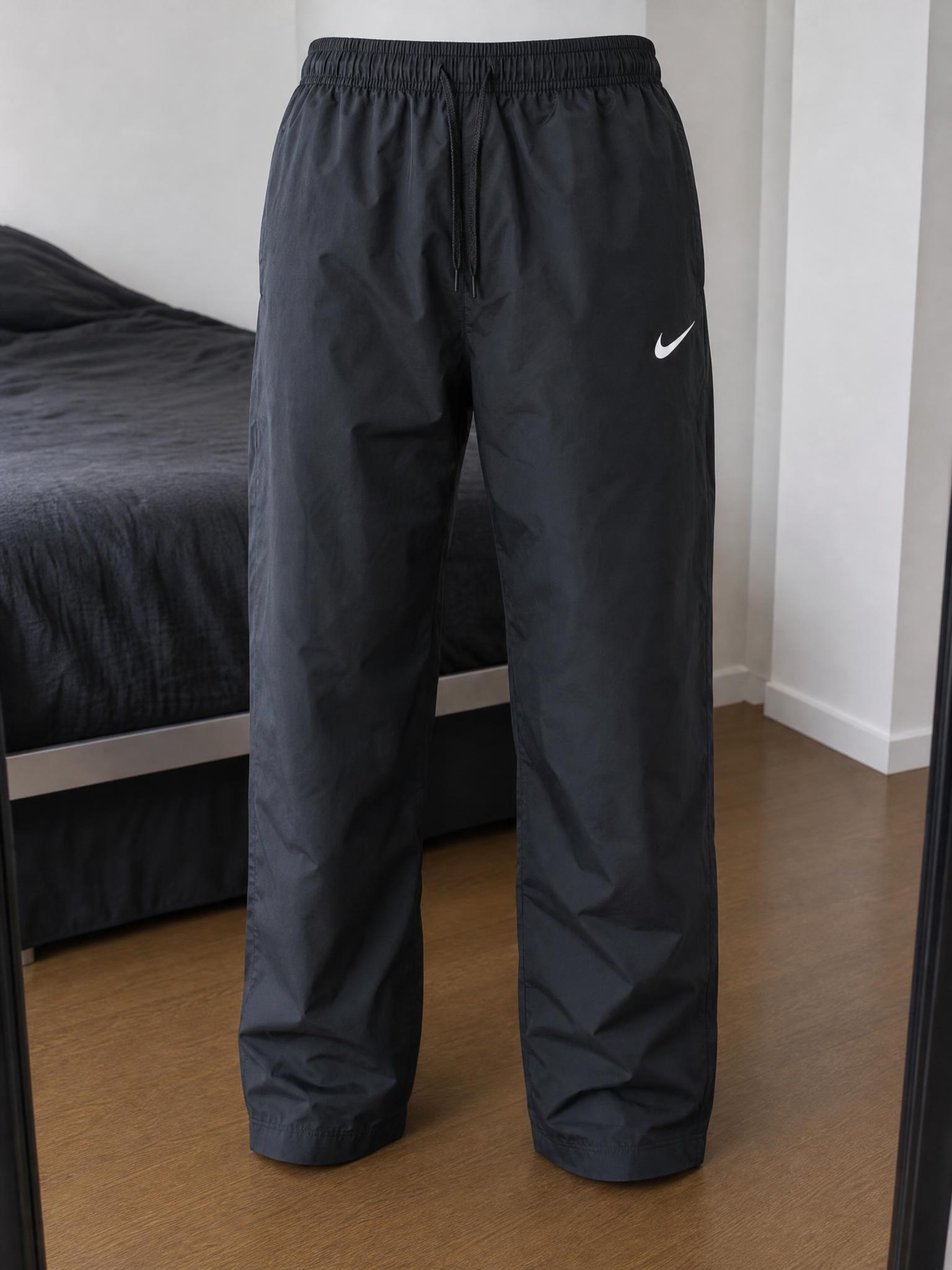 Nike black lightweight track trousers with Swoosh – very good