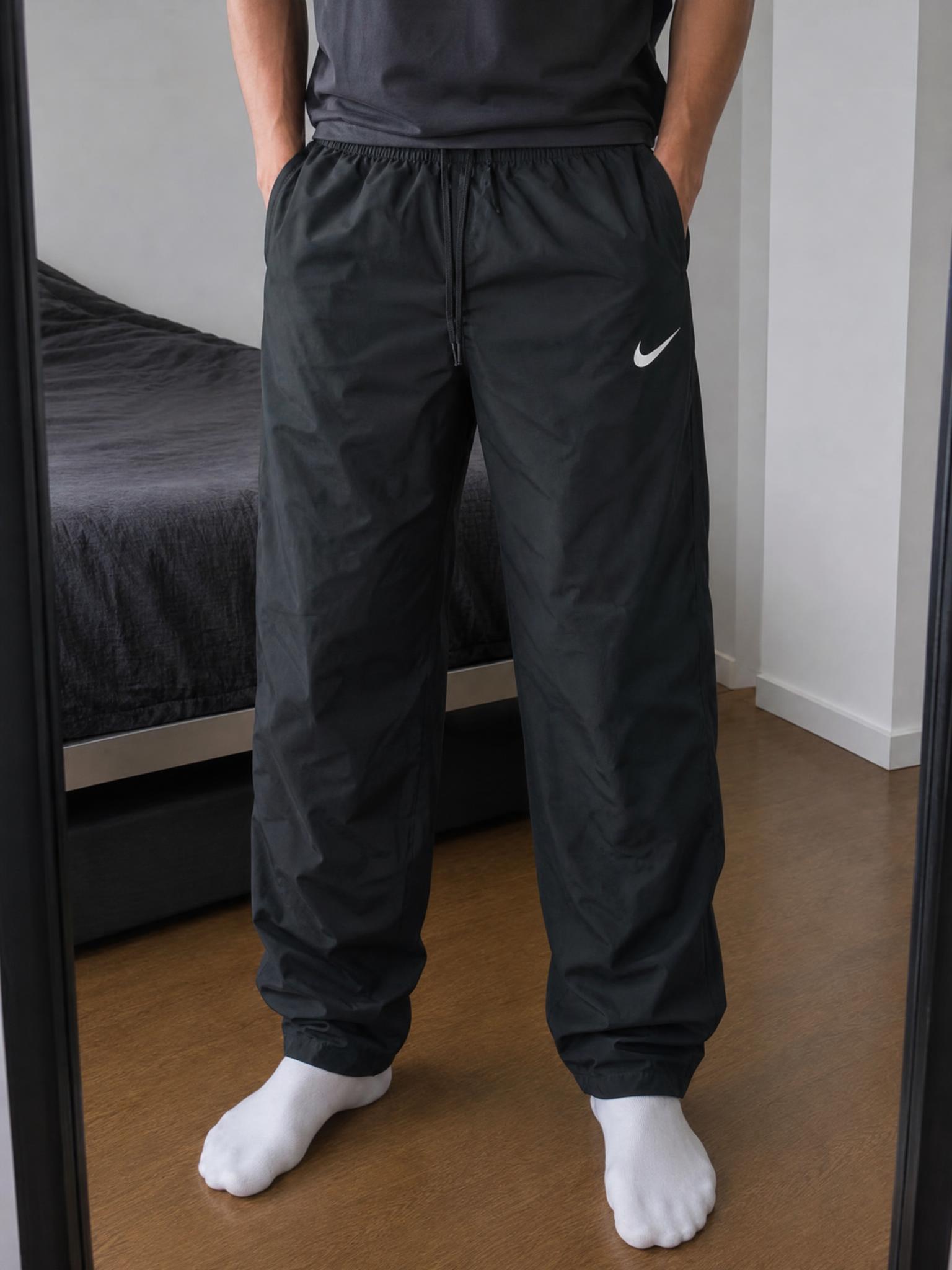 Nike black woven sports trousers with zip pockets - very good